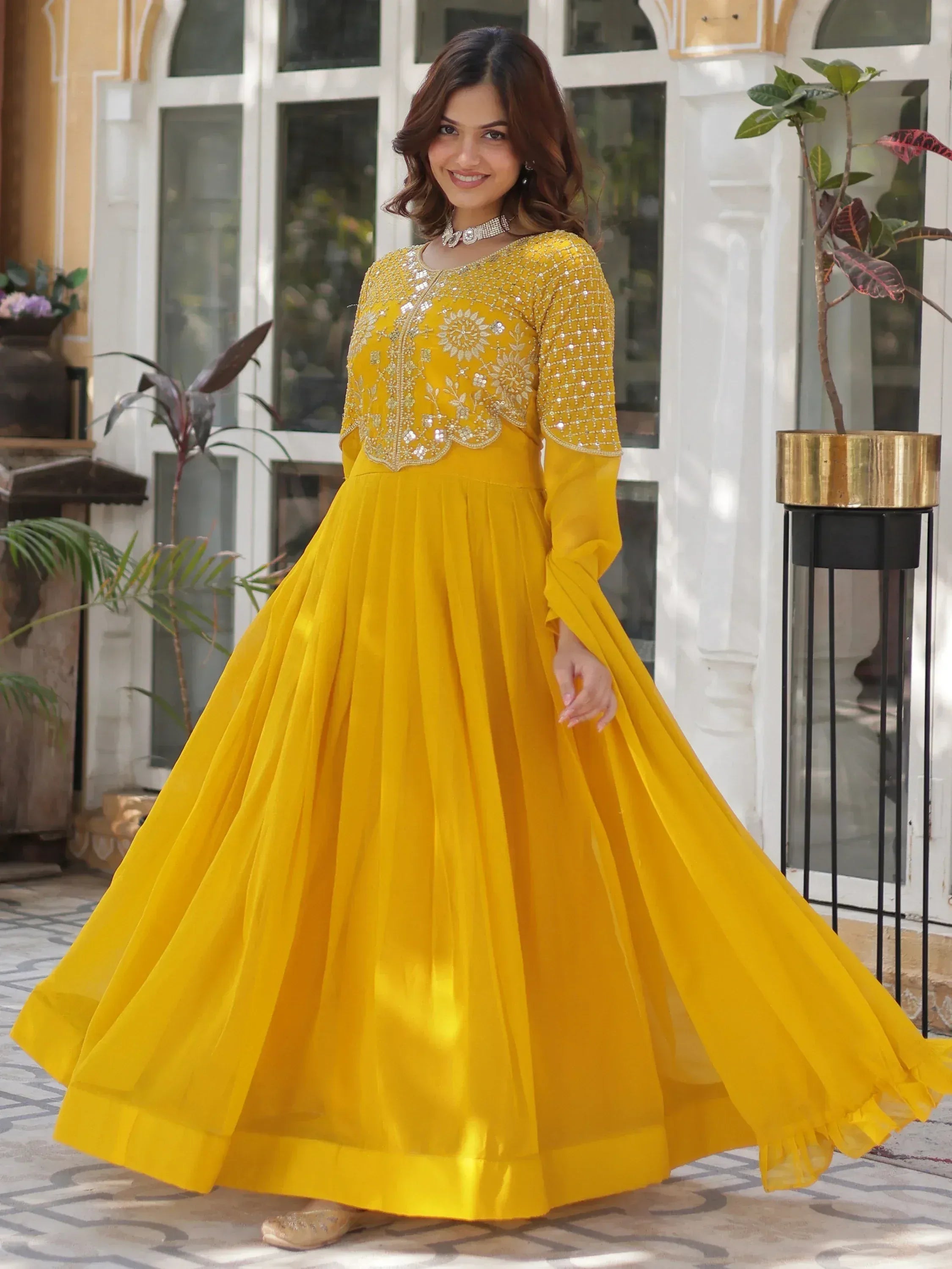 Yellow embroidered ethnic gown with flared skirt for festive occasions
