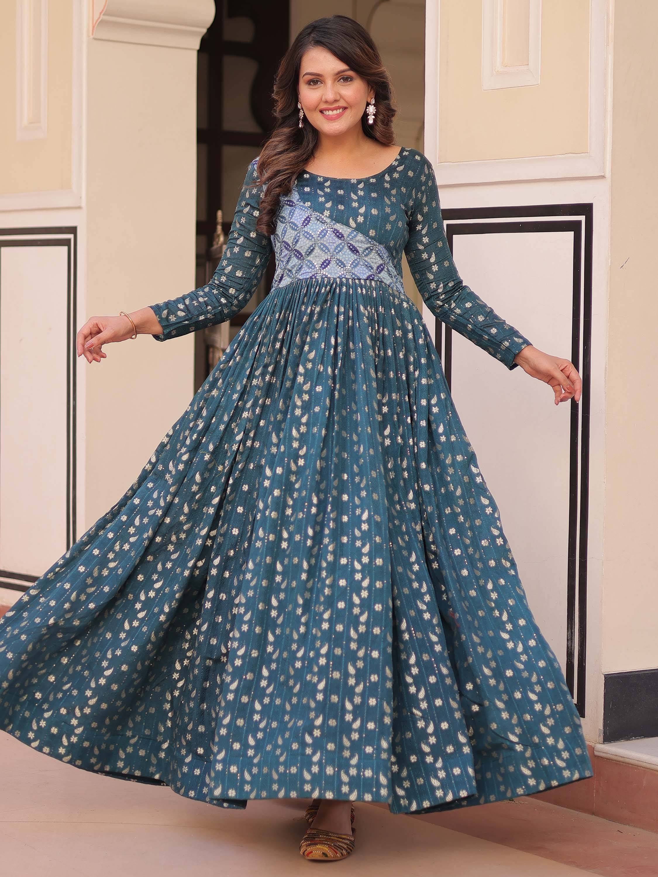 Teal ethnic gown with floral print and pleated skirt, perfect for Indian occasions