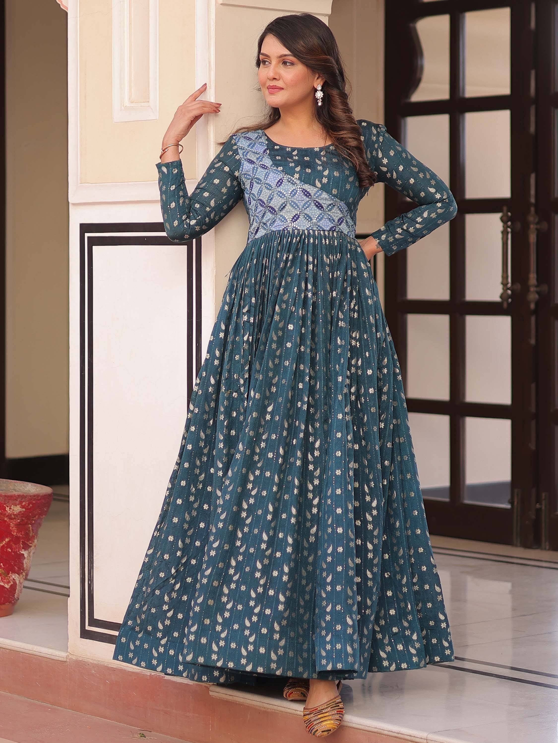 Teal ethnic gown with floral print and pleated skirt, perfect for Indian occasions