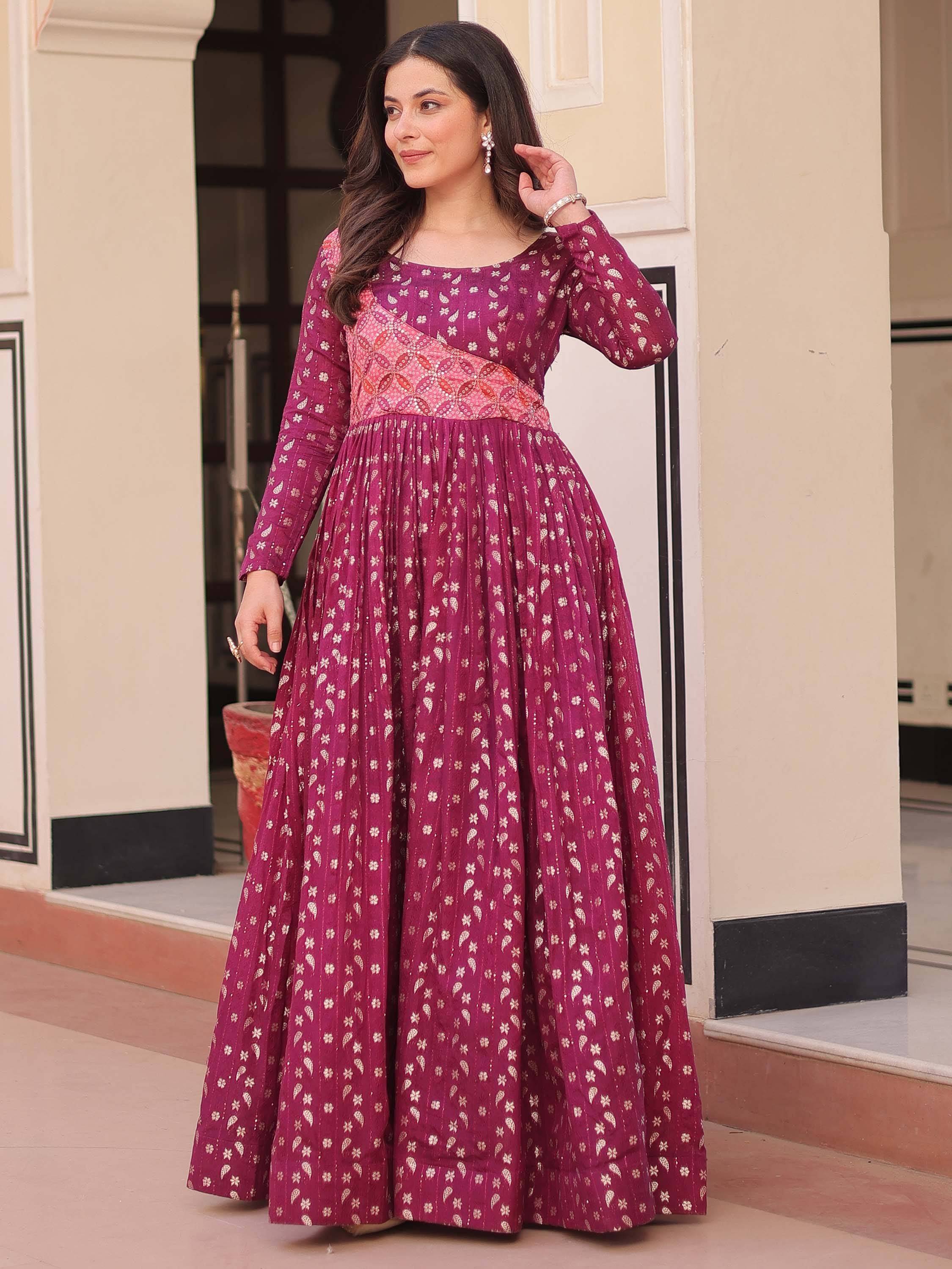 Elegant maroon ethnic gown with floral print, perfect for Indian celebrations and events.