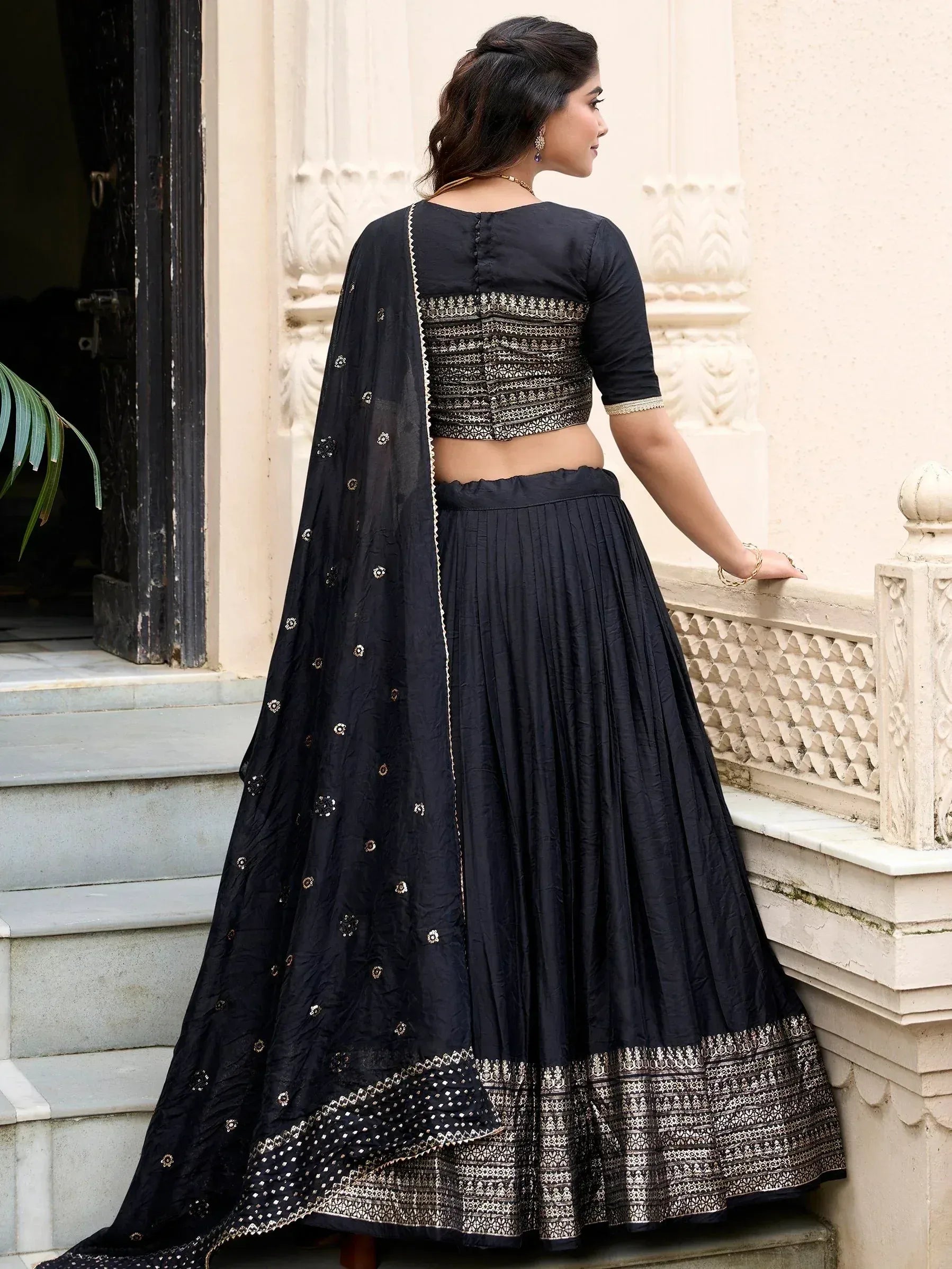 Black embroidered lehenga choli with gold detailing, perfect for Indian ethnic wear occasions