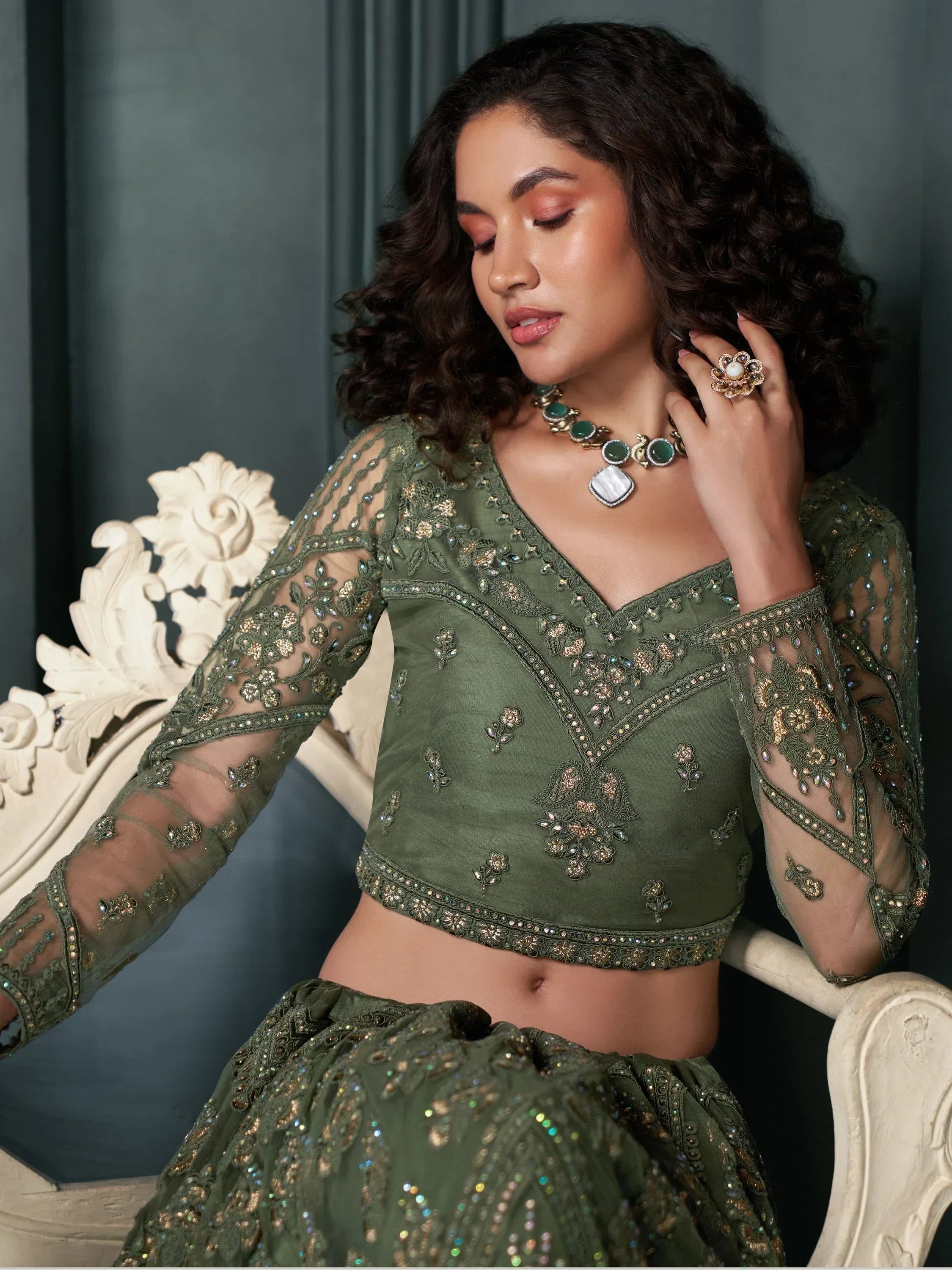 Olive green embroidered lehenga choli with sheer sleeves, perfect for Indian ethnic wear events.