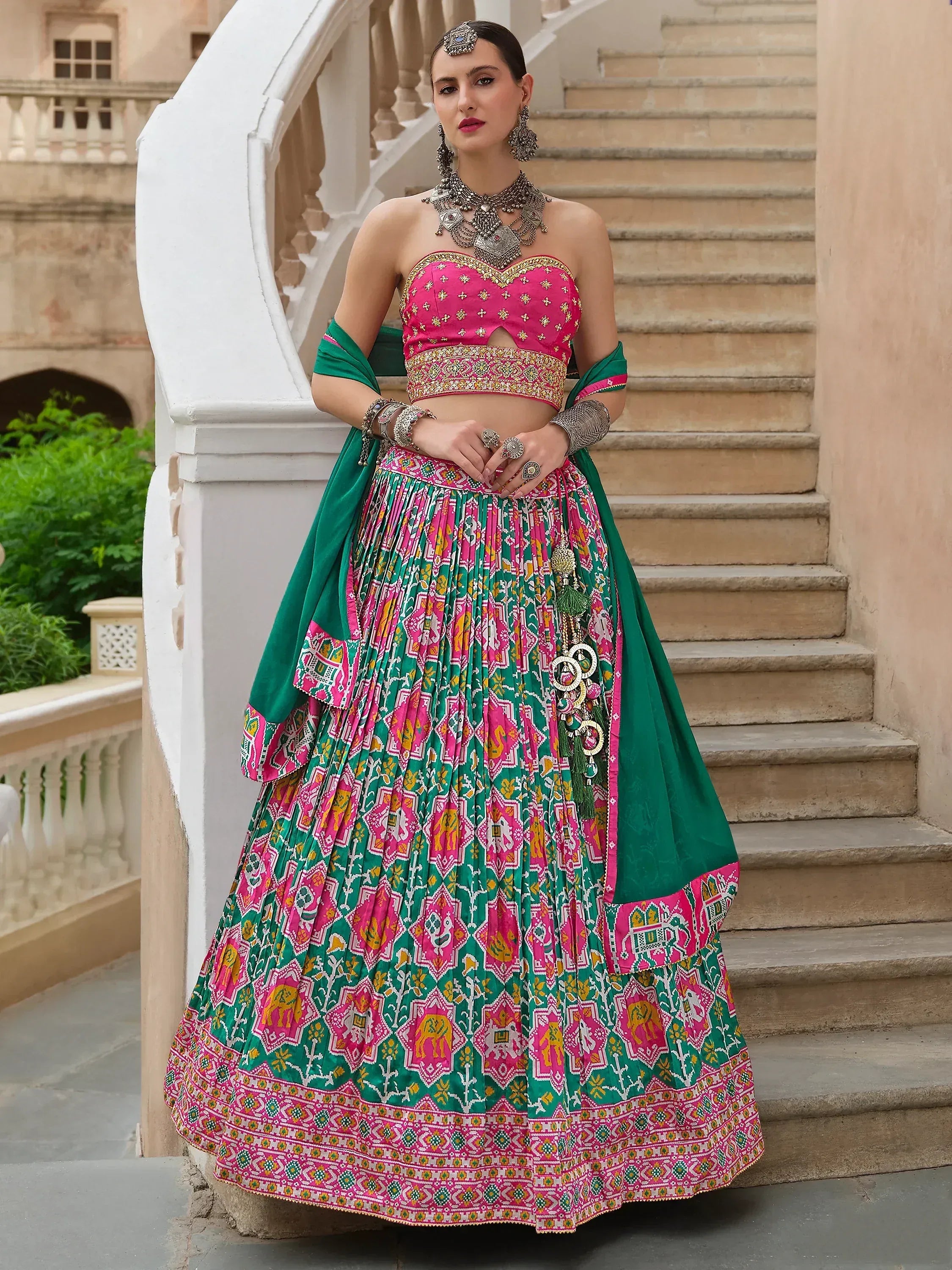 Pink and green printed lehenga choli with embroidery, perfect for Indian ethnic wear and festive occasions.