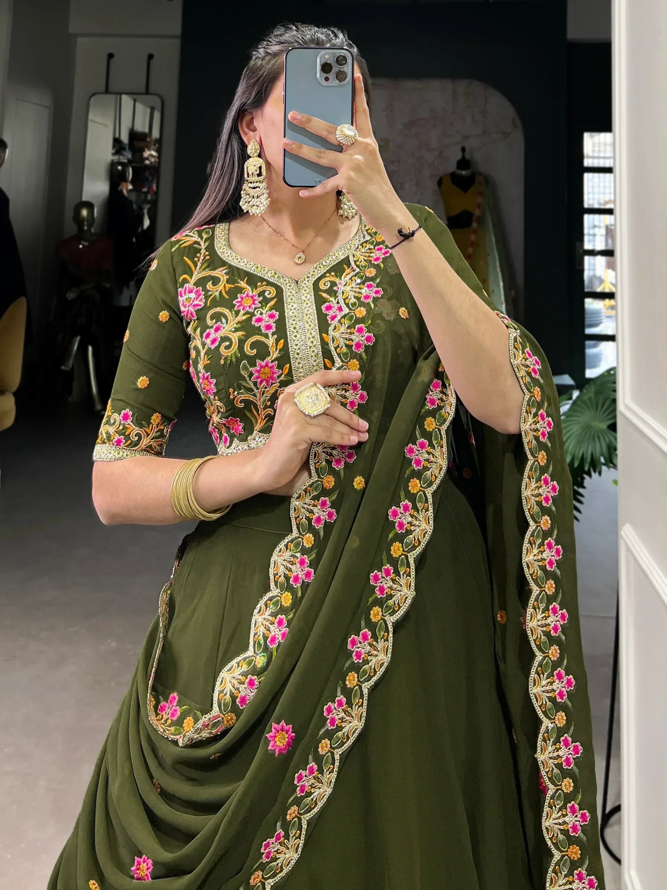 Olive green embroidered Indian salwar kameez with floral motifs, perfect for ethnic wear occasions.