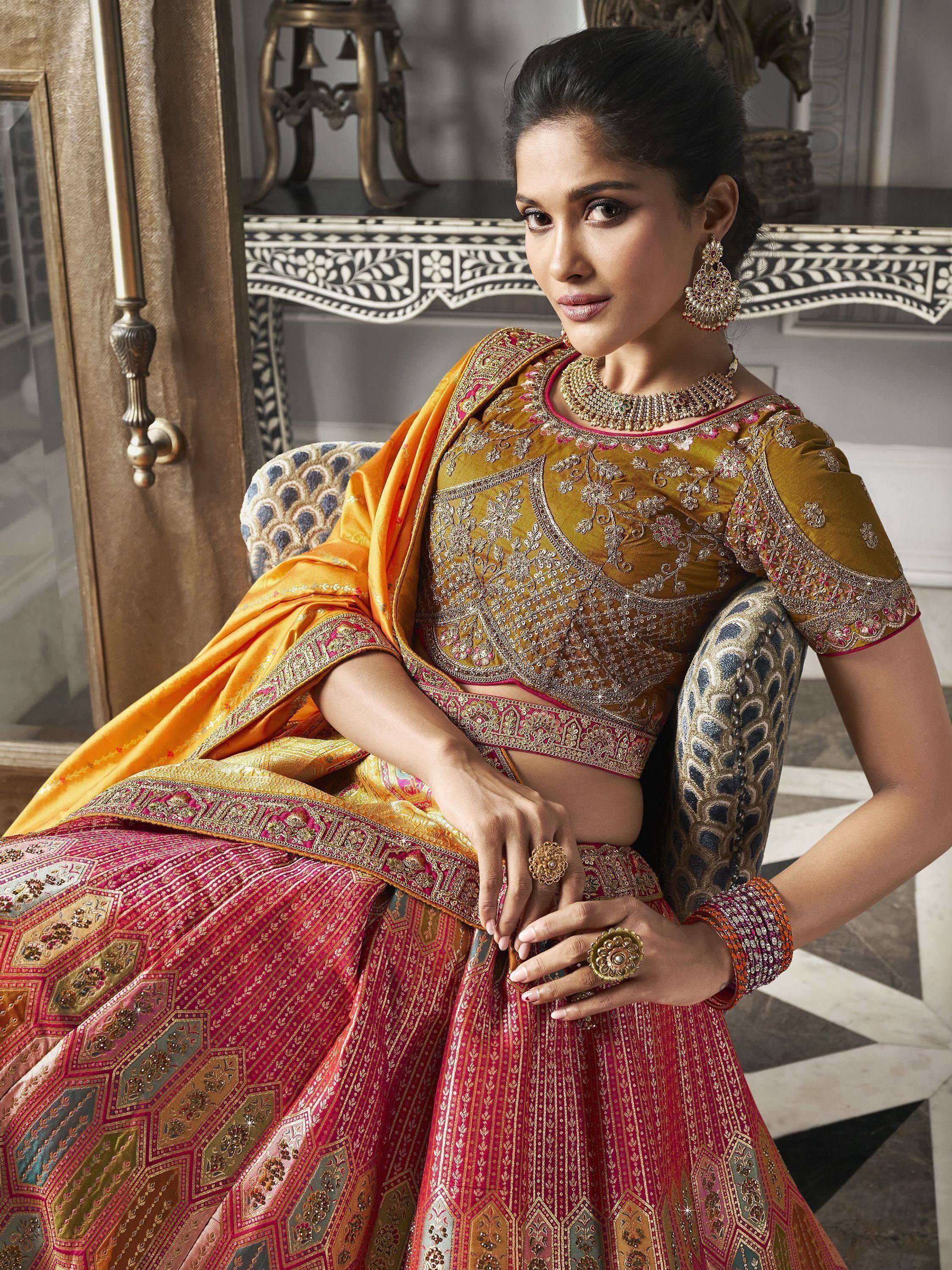Elegant Indian designer lehenga choli with intricate embroidery, perfect for weddings and festive occasions.