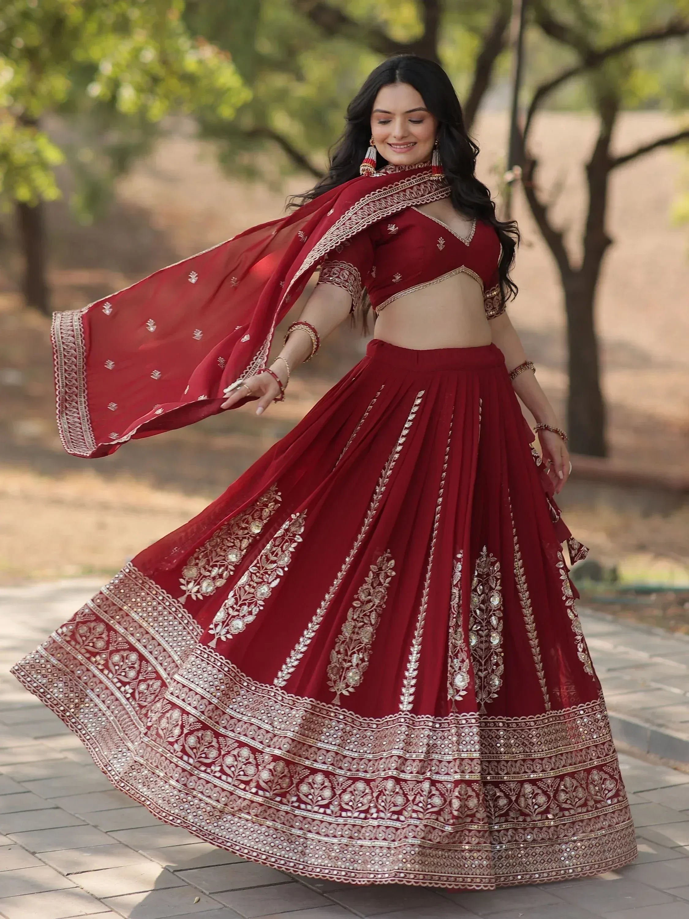 Red embroidered lehenga choli with gold detailing, perfect for Indian ethnic wear and festive occasions.