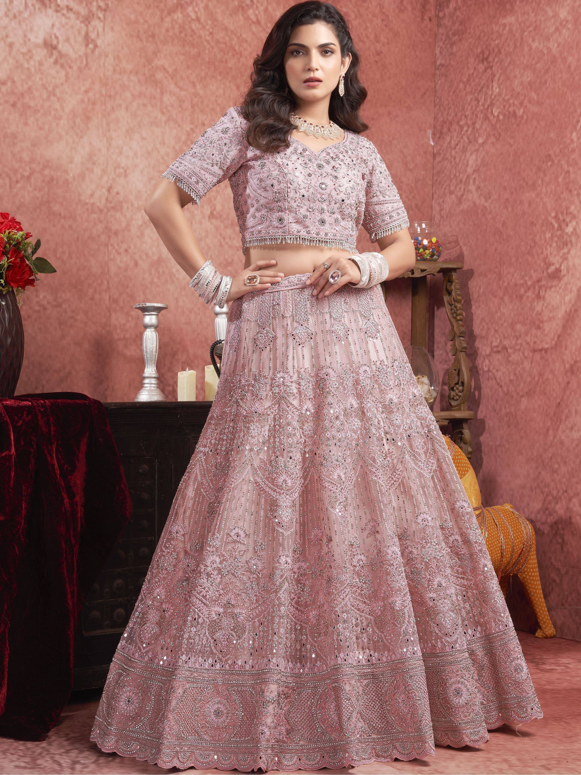 Pink embroidered lehenga choli with heavy embellishments, perfect for Indian weddings and festive occasions