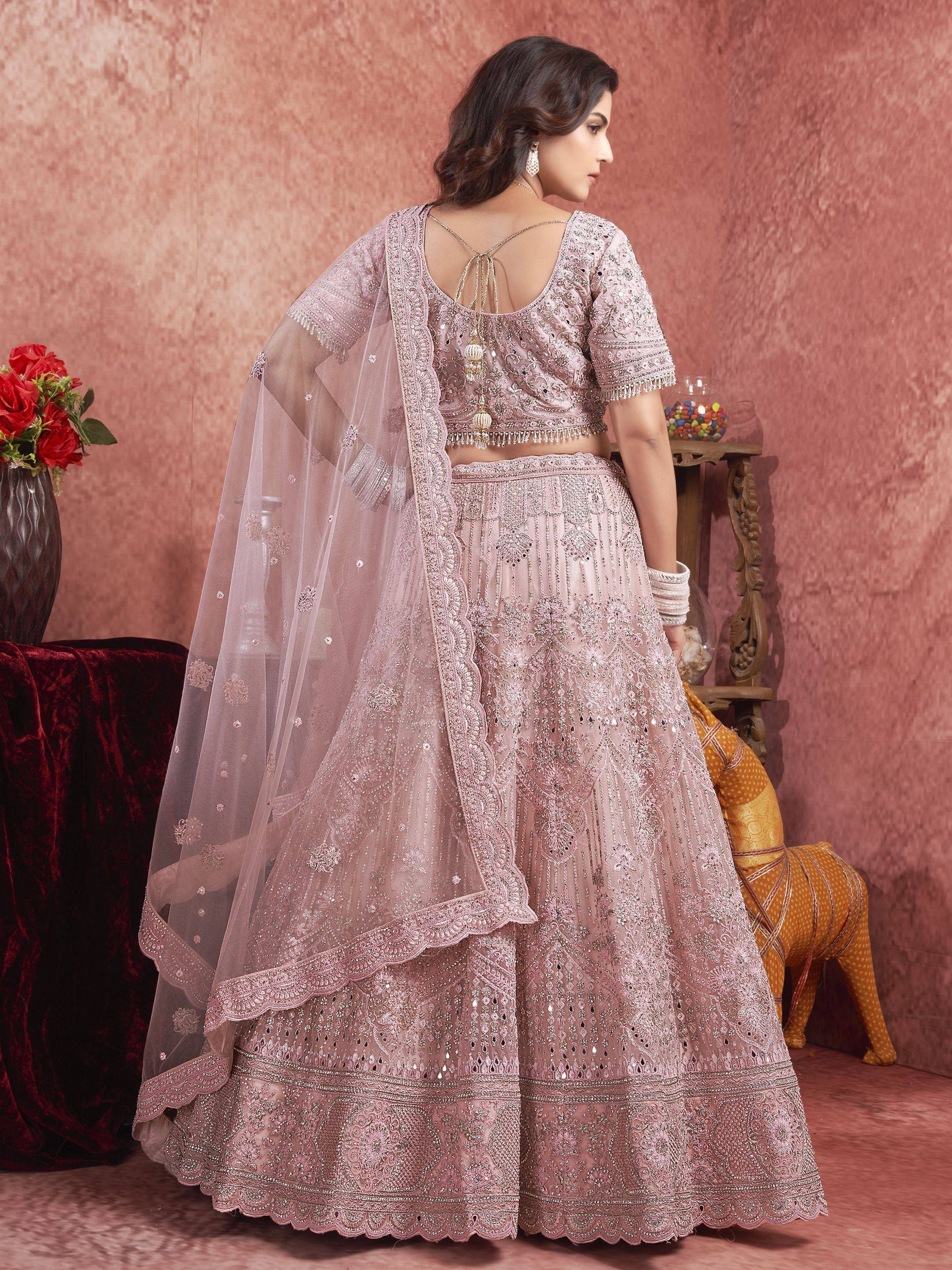 Pink embroidered lehenga choli with sheer dupatta, perfect for Indian weddings and festive occasions