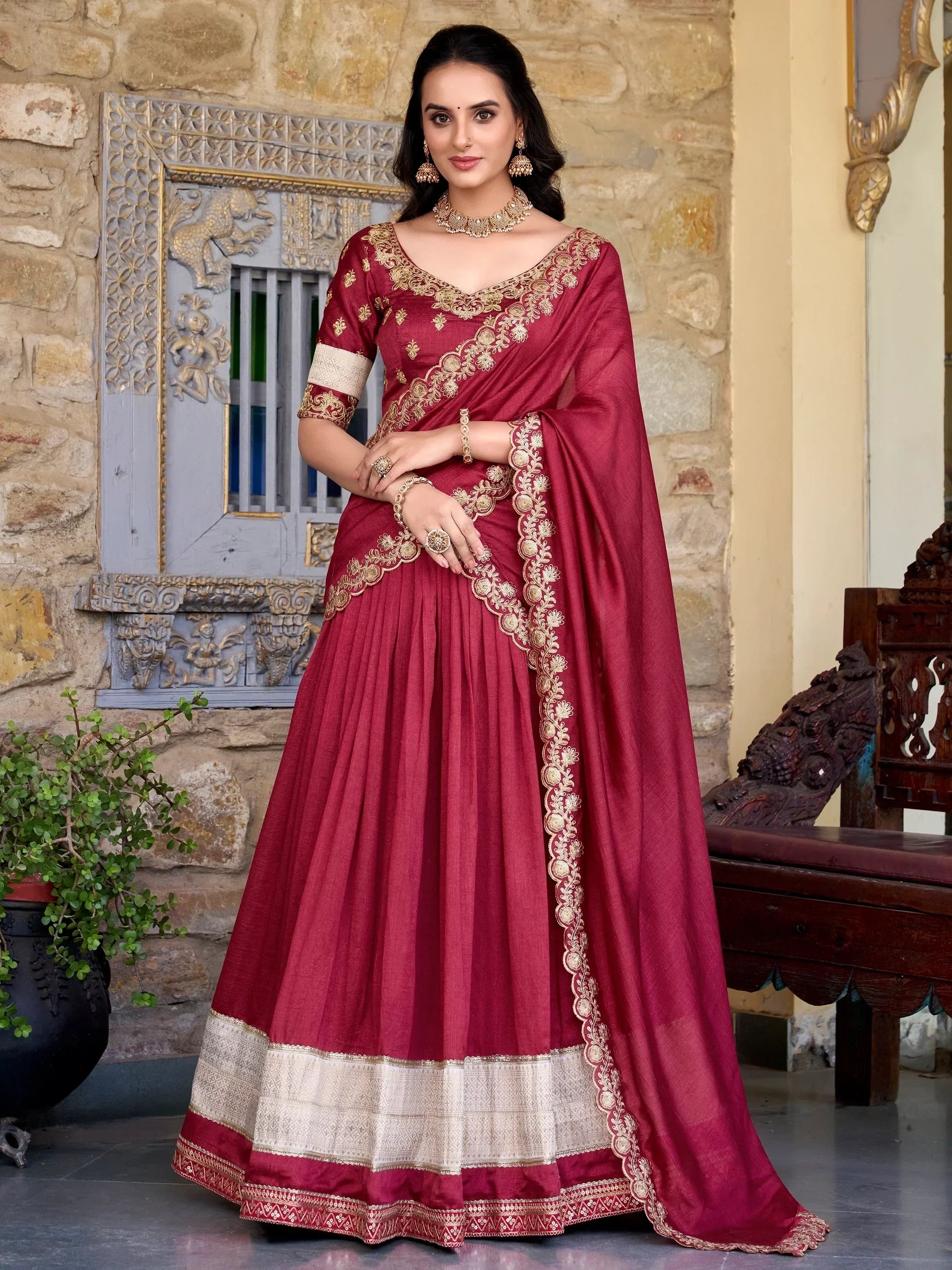 Maroon designer lehenga choli with gold embroidery, perfect for Indian ethnic wear and festive occasions