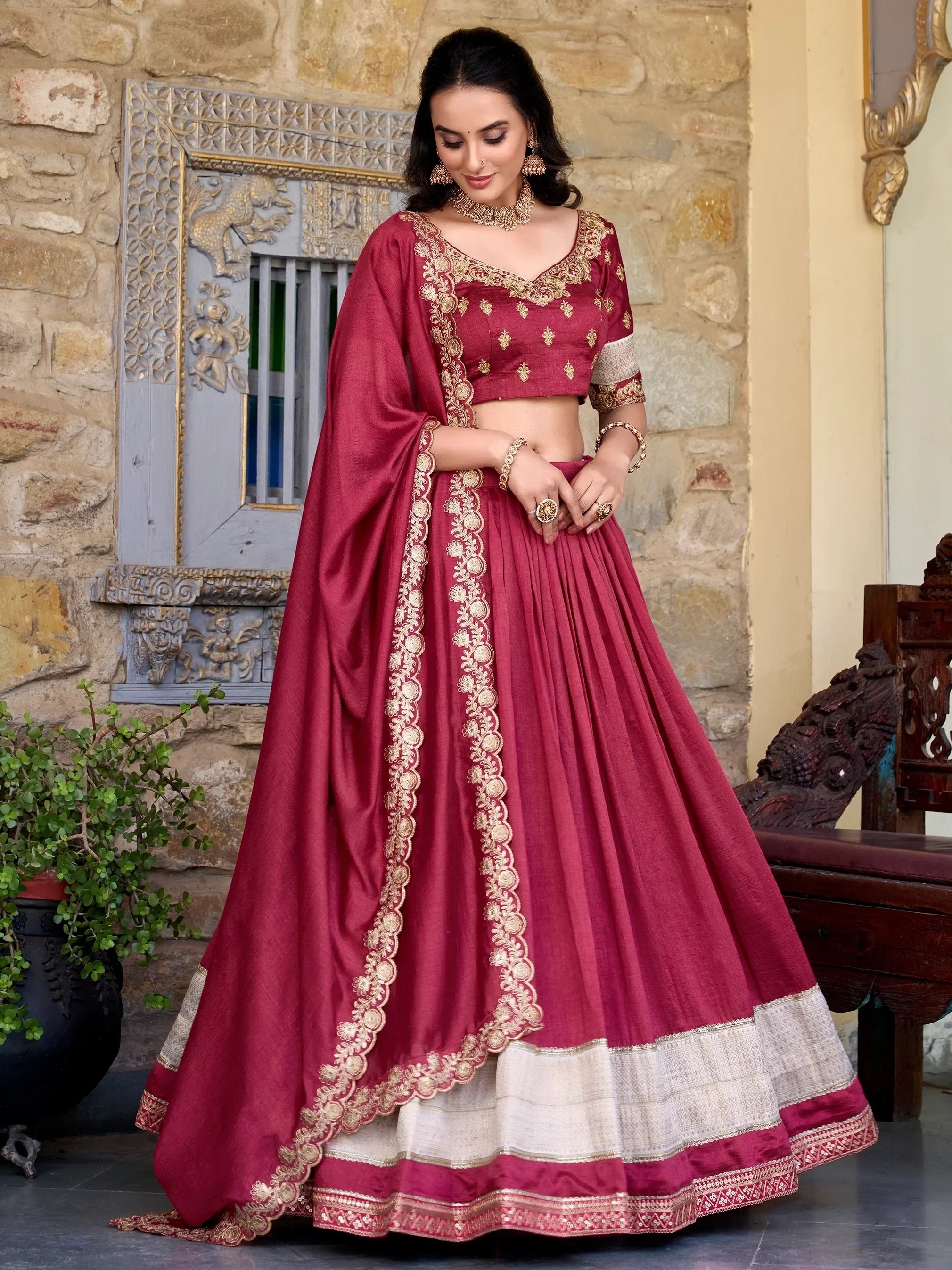 Maroon designer lehenga choli with gold embroidery, perfect for Indian ethnic wear occasions