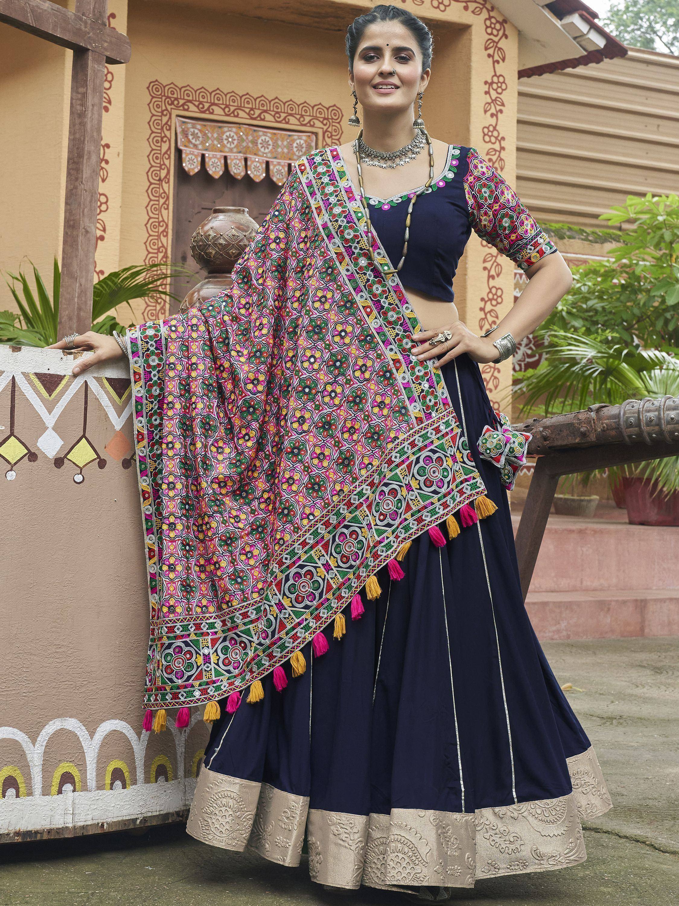 Navy blue lehenga choli with vibrant floral embroidered dupatta and tassels, perfect for Indian ethnic wear