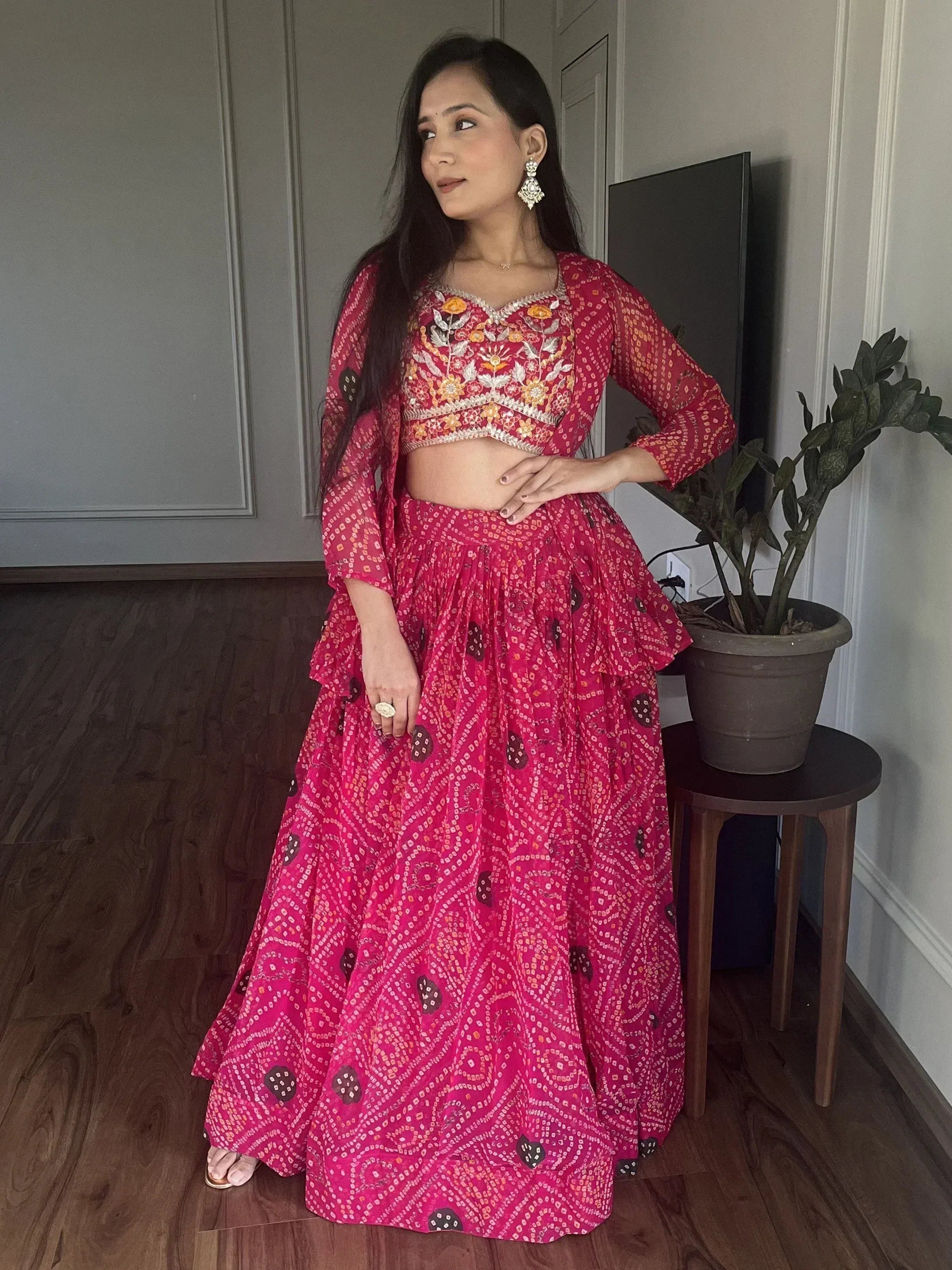 Pink embroidered lehenga choli with floral motifs, perfect for Indian ethnic wear and festive occasions.
