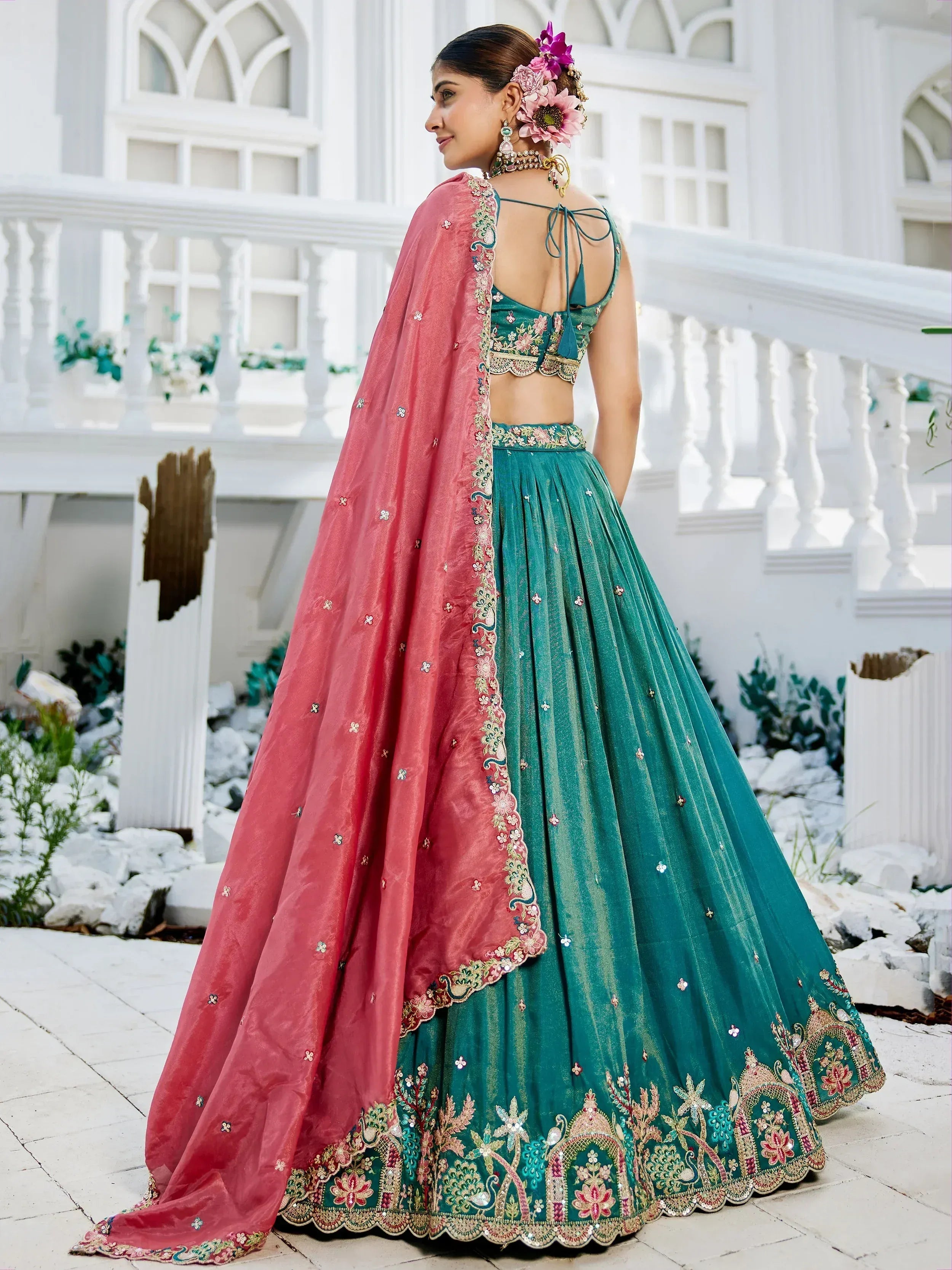 Teal lehenga choli with pink dupatta, floral embroidery, perfect for Indian weddings and festive occasions