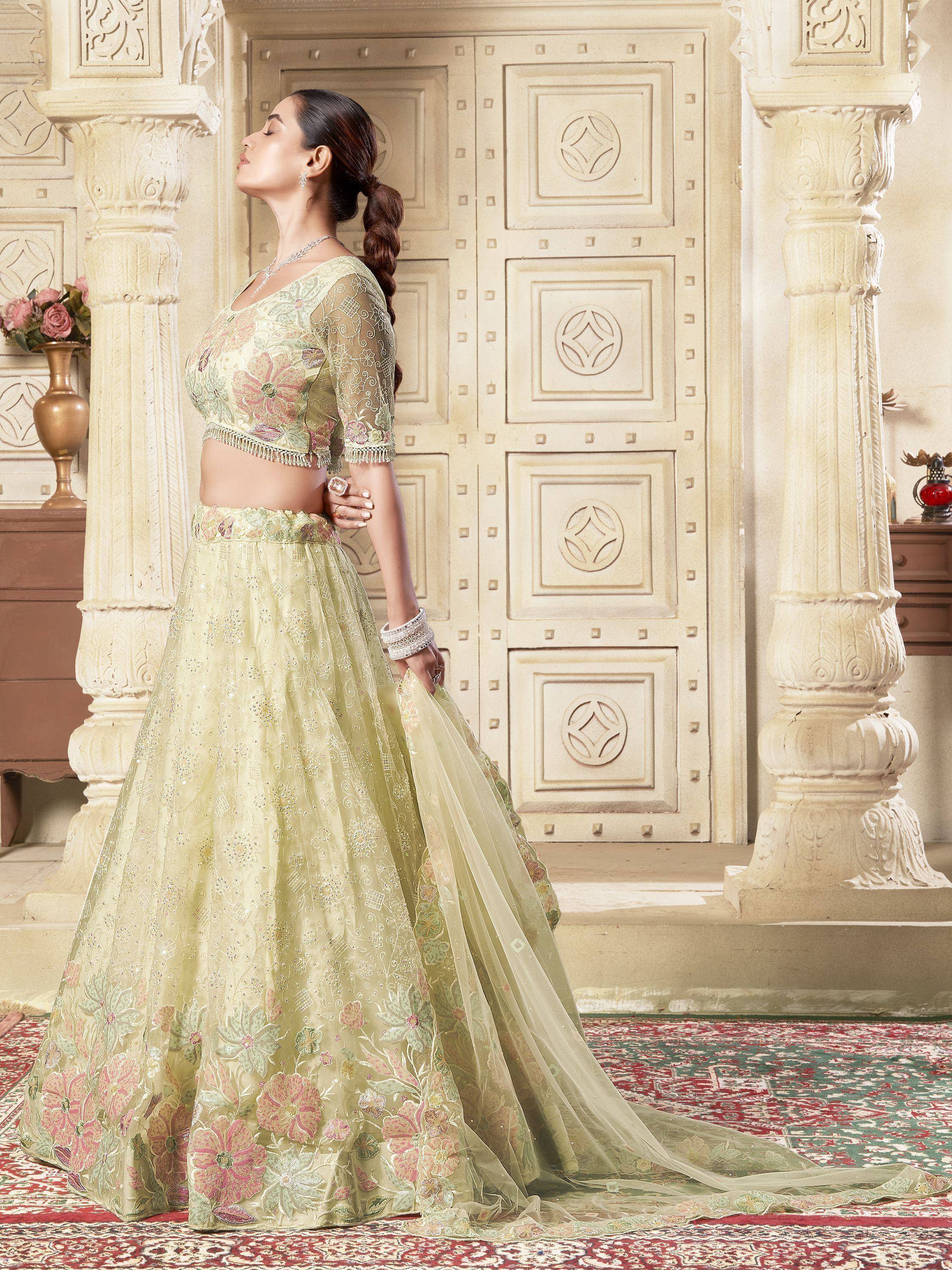Elegant light green lehenga choli with floral embroidery, perfect for Indian ethnic occasions and weddings.