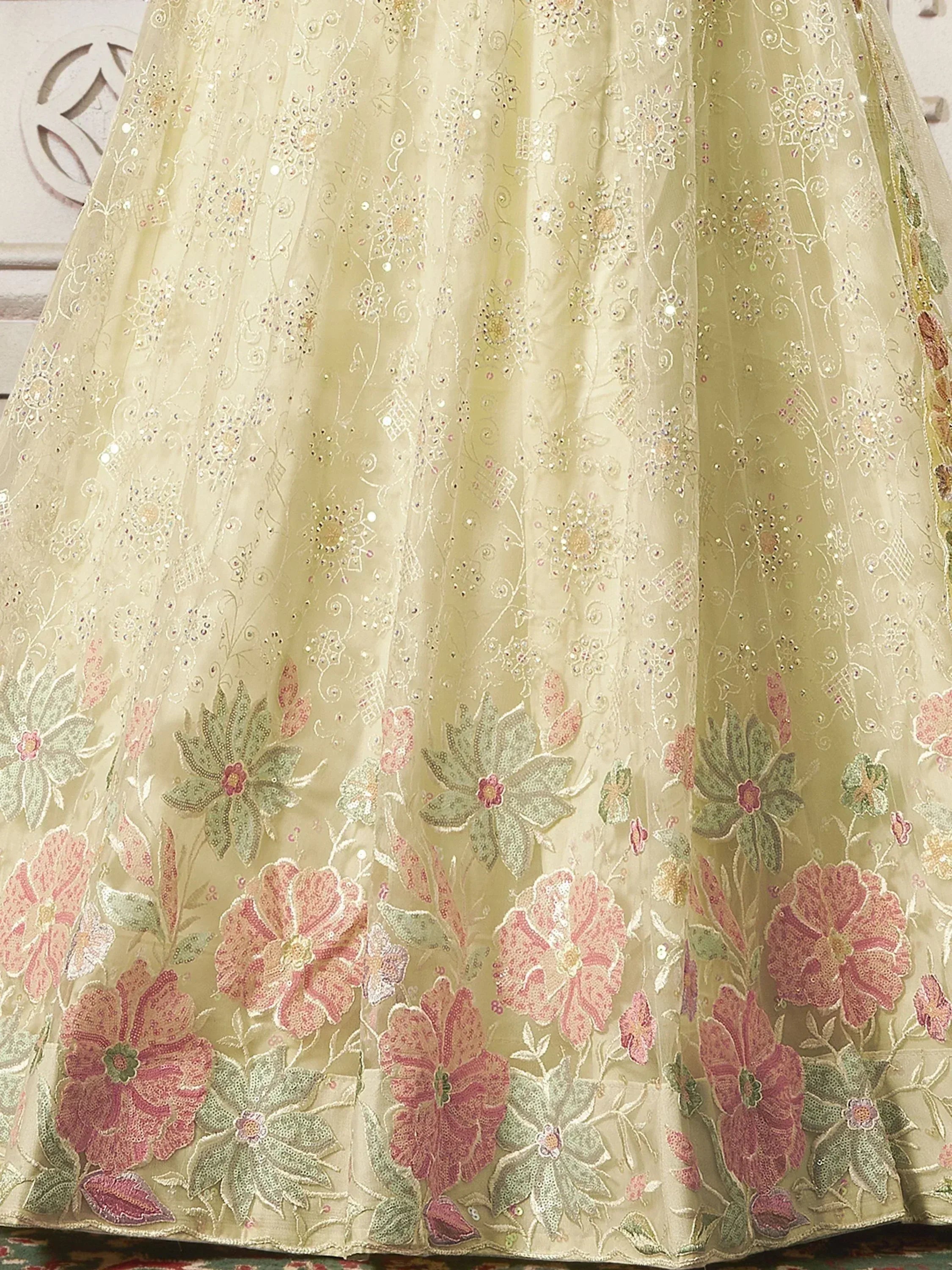 Elegant floral embroidered lehenga skirt with sequins and pastel blooms, perfect for Indian ethnic wear.