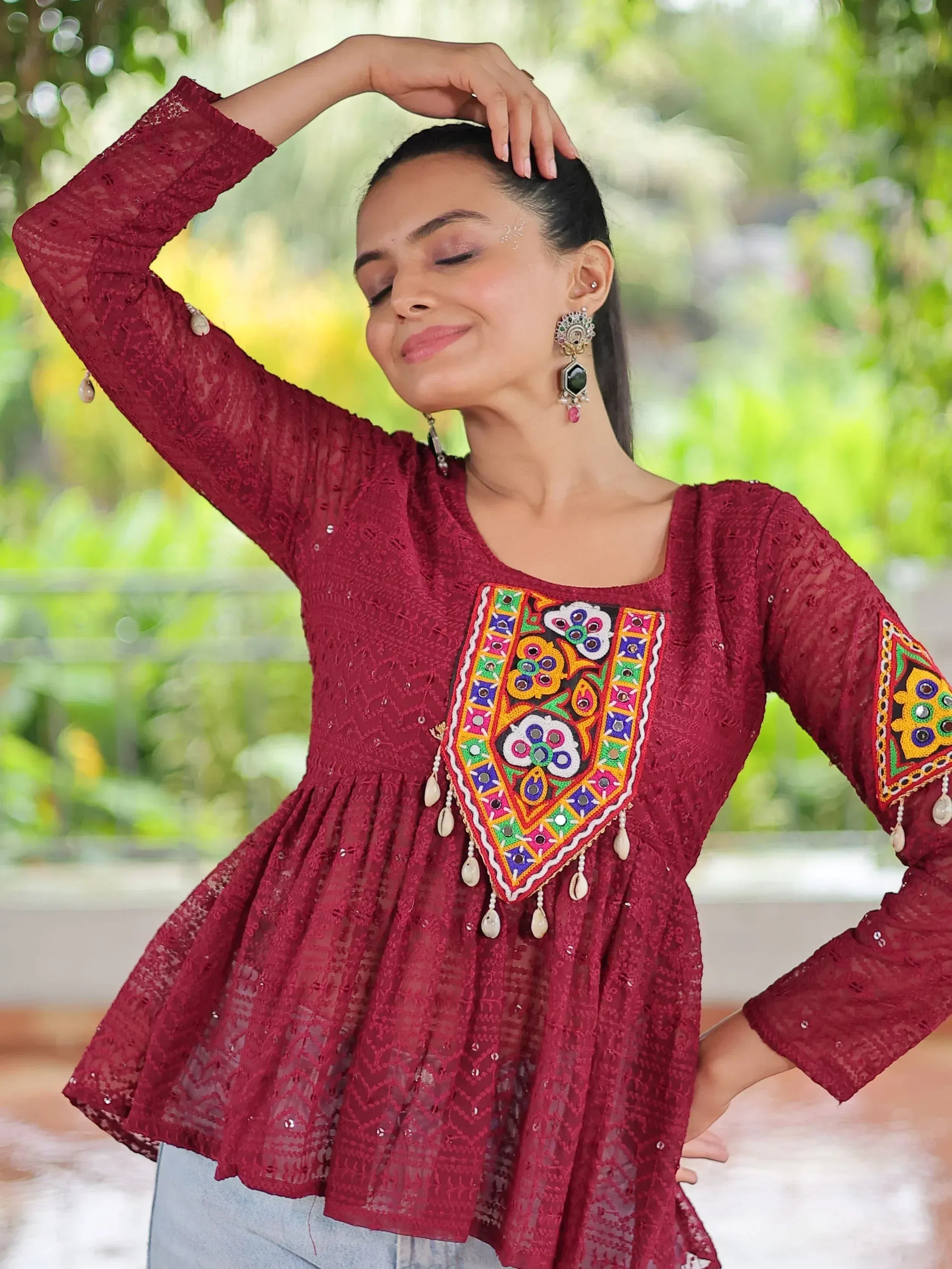 Maroon lace ethnic top with colorful mirror embroidery and tassels, perfect for Indian wear