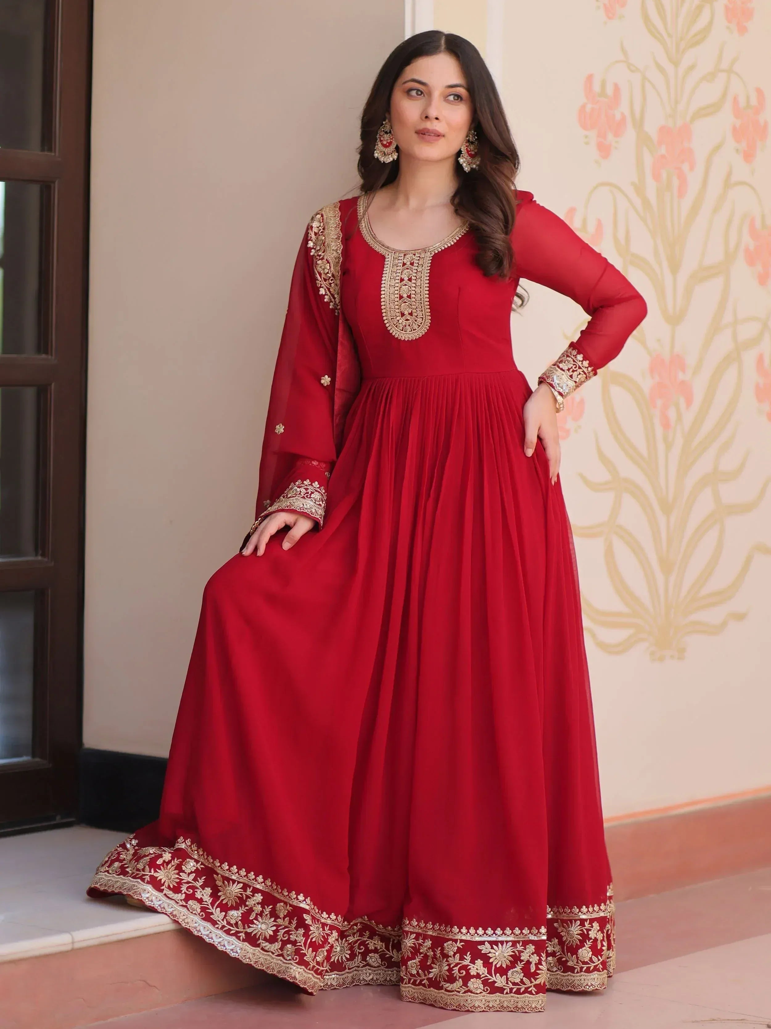 Red ethnic gown with gold embroidery, perfect for Indian weddings and festive occasions