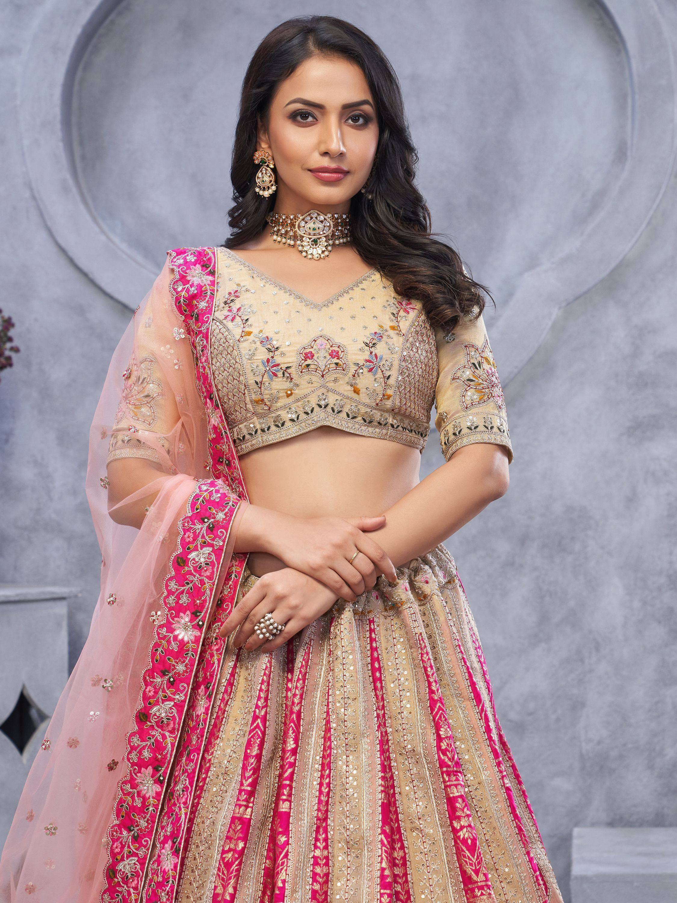 Elegant beige and pink embroidered lehenga choli with floral motifs and sheer dupatta for Indian ethnic wear