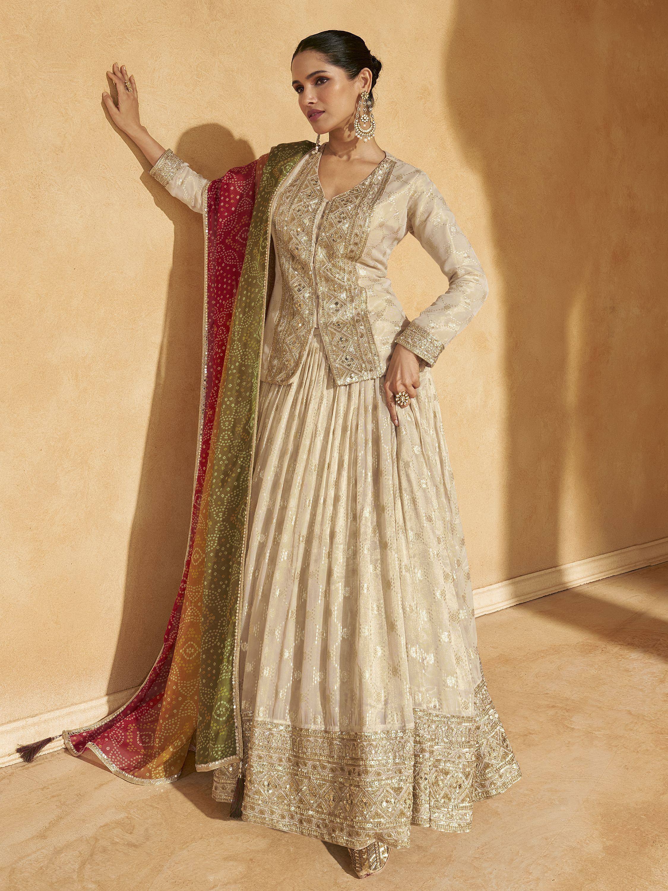 Elegant cream embroidered lehenga choli with dupatta, perfect for Indian ethnic wear and festive occasions.