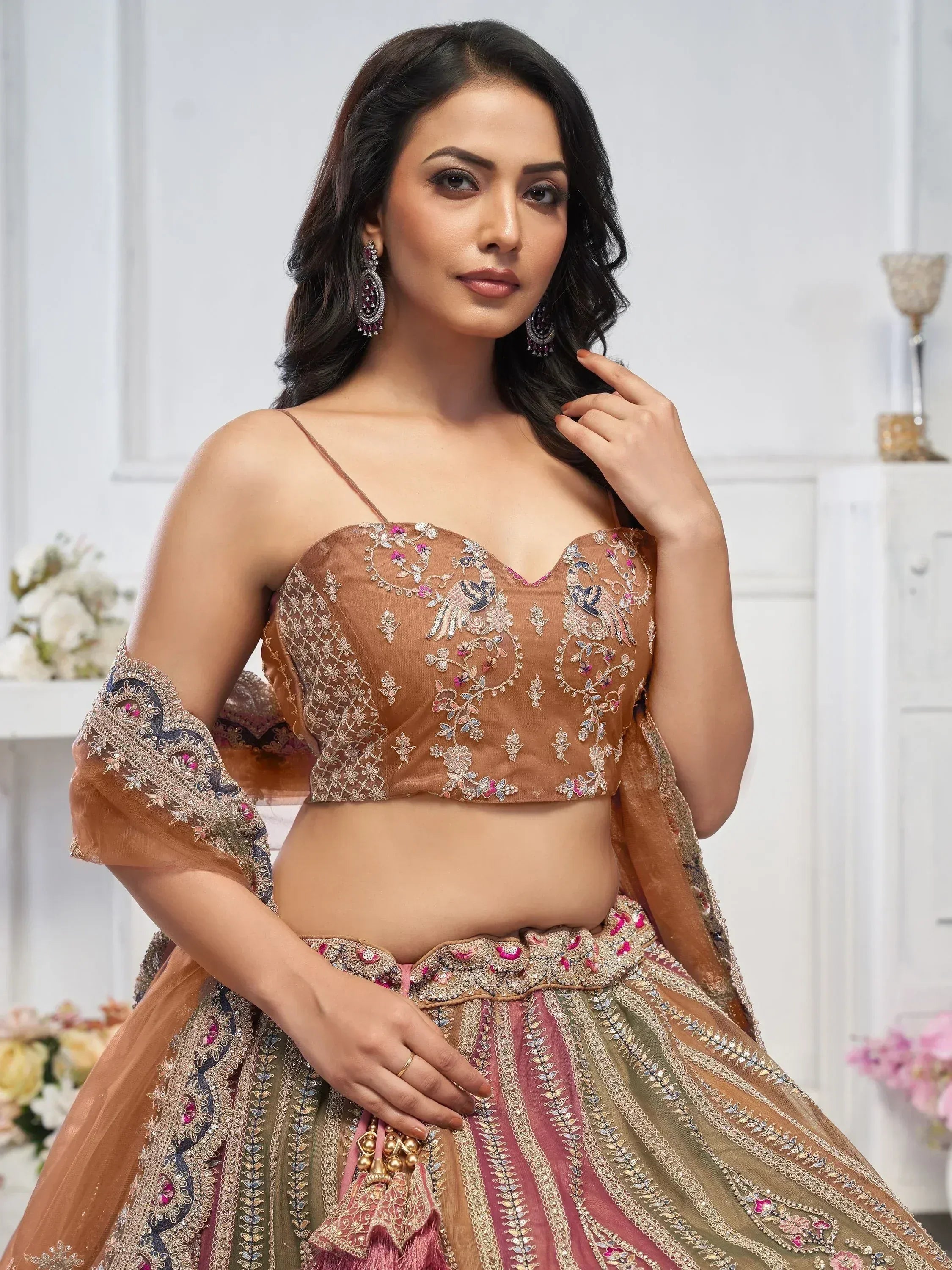 Elegant Indian lehenga choli with peacock embroidery, perfect for weddings and festive occasions.