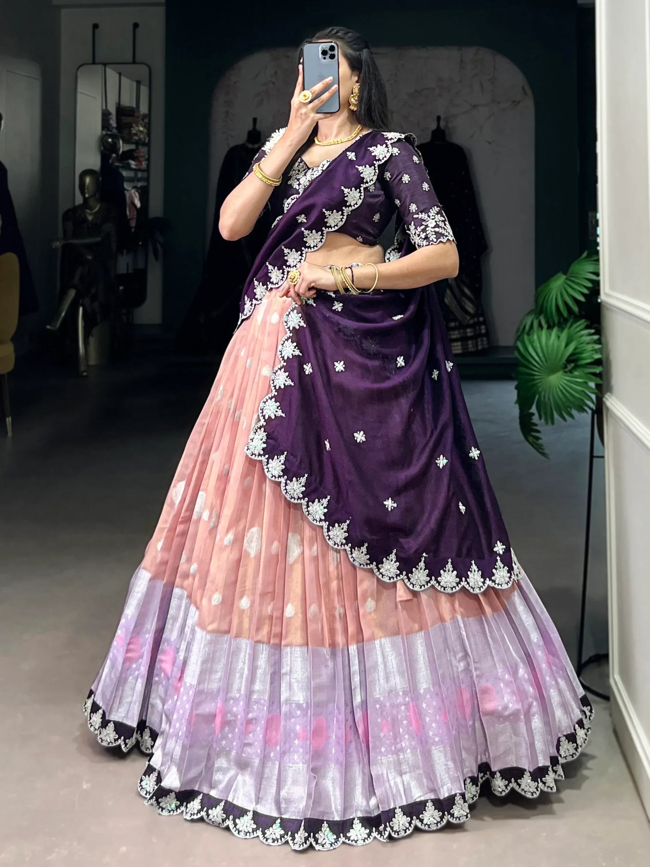 Purple and pink embroidered lehenga choli with floral detailing, perfect for Indian ethnic wear occasions.