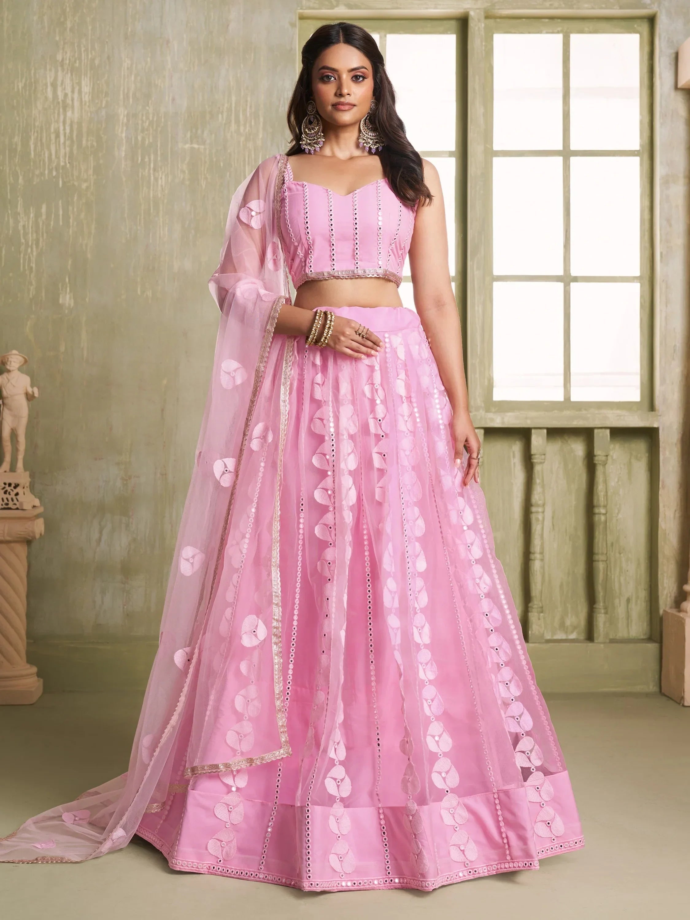 Pink designer lehenga choli with floral embroidery and sheer dupatta for Indian ethnic wear