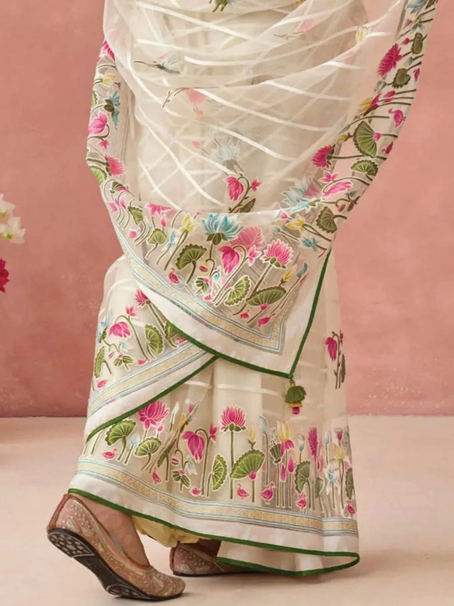 White floral printed saree with pink lotus design, green border, and sheer dupatta for ethnic wear