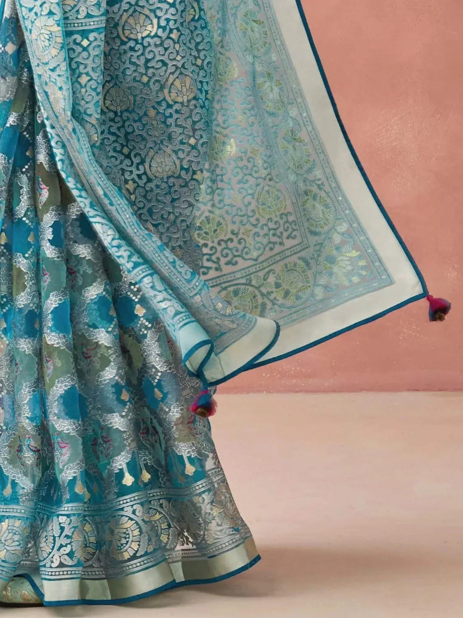Teal designer lehenga choli with intricate silver and gold embroidery, perfect for Indian ethnic wear occasions.