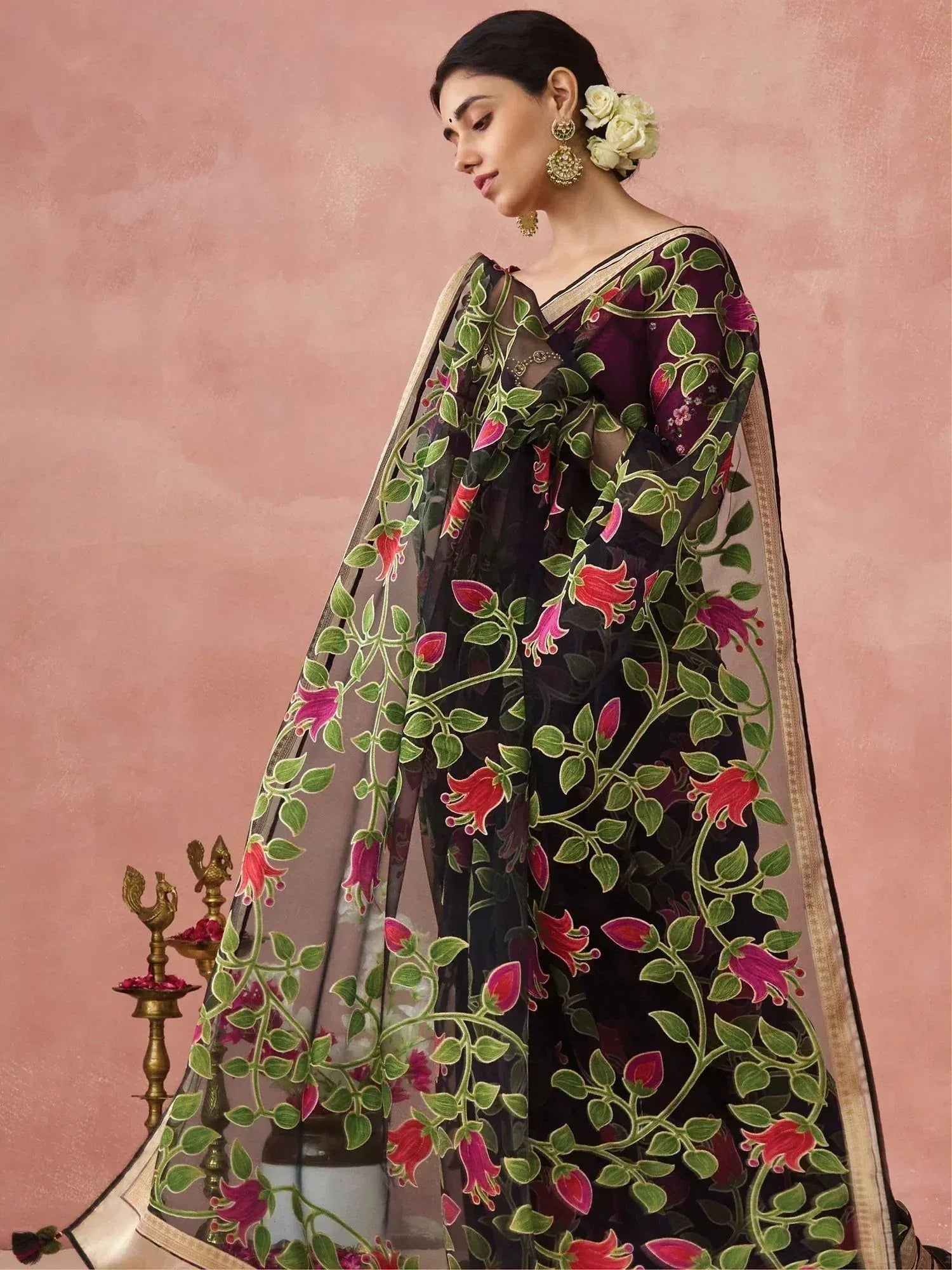 Elegant black saree with vibrant floral embroidery, perfect for Indian ethnic occasions.
