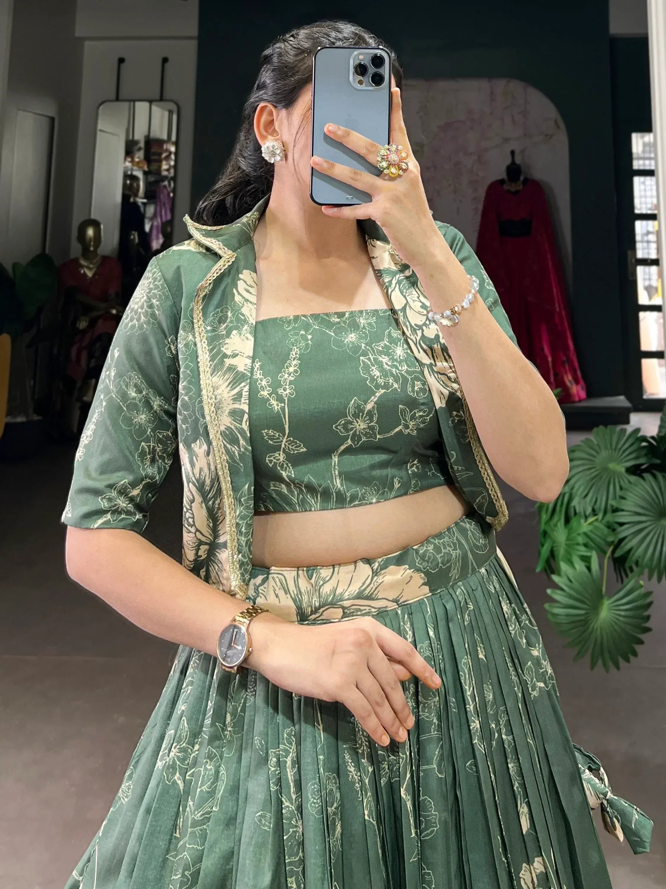Green floral print lehenga choli with gold trim, perfect for Indian ethnic wear and festive occasions.