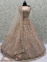 Mesmerizing Peach Sequins Wedding Wear Lehenga Choli