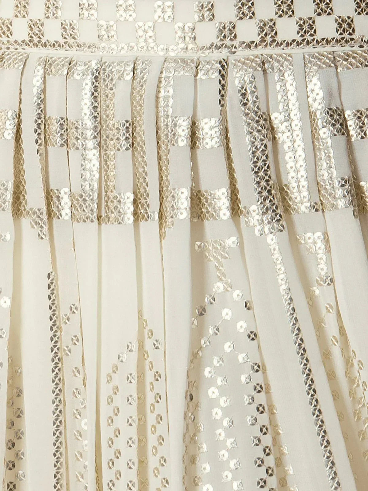 Cream ethnic gown with gold and silver sequin embroidery, pleated design, perfect for festive occasions