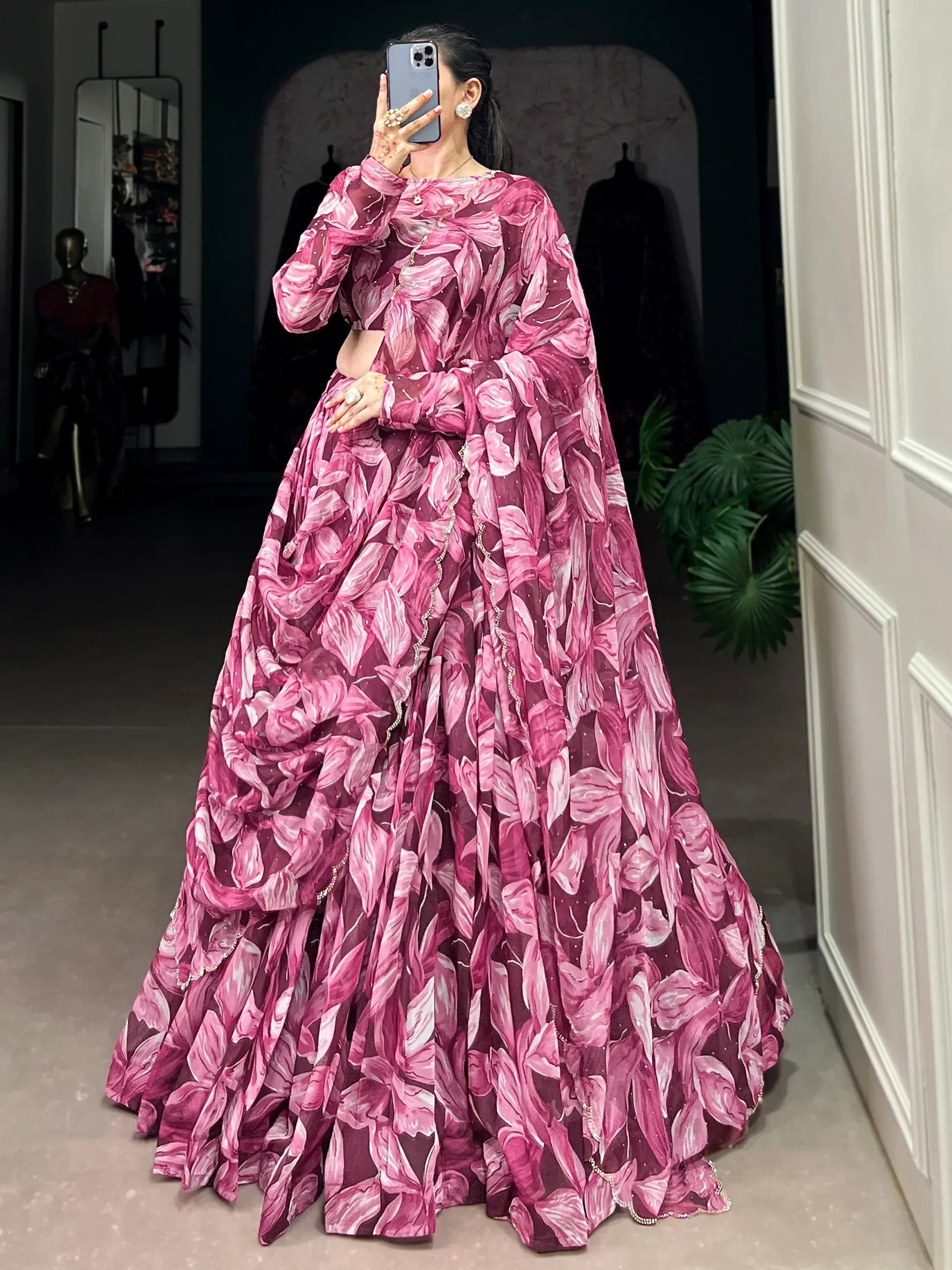 Pink floral print designer lehenga choli with sheer dupatta, perfect for weddings and festive occasions.
