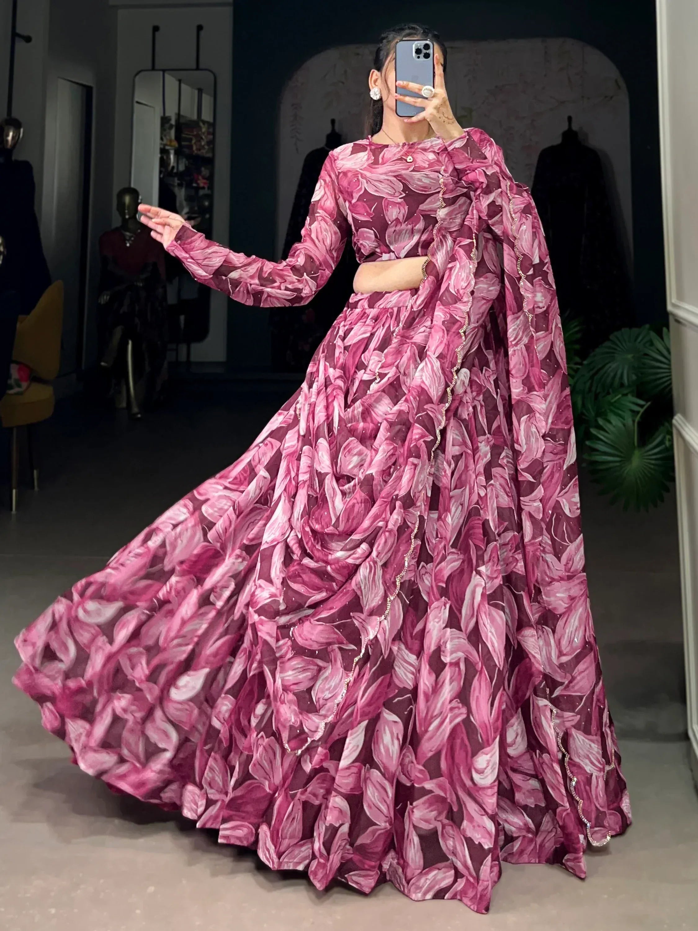 Pink floral print lehenga choli with long sleeves and embellished border, perfect for Indian ethnic wear events