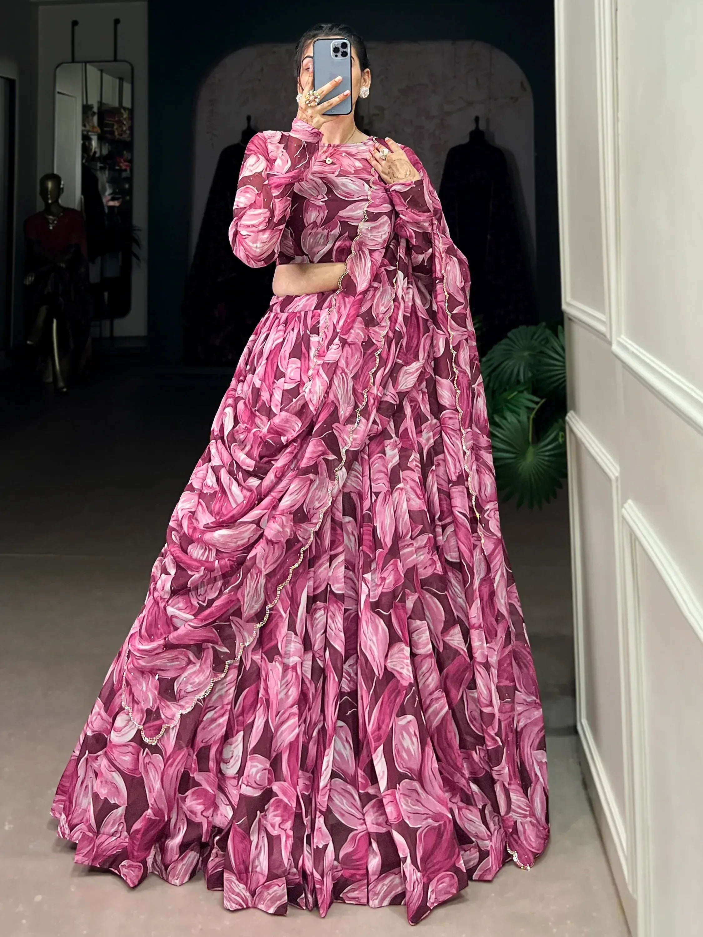 Pink floral print lehenga choli with sheer sleeves and embellished border, perfect for Indian ethnic occasions