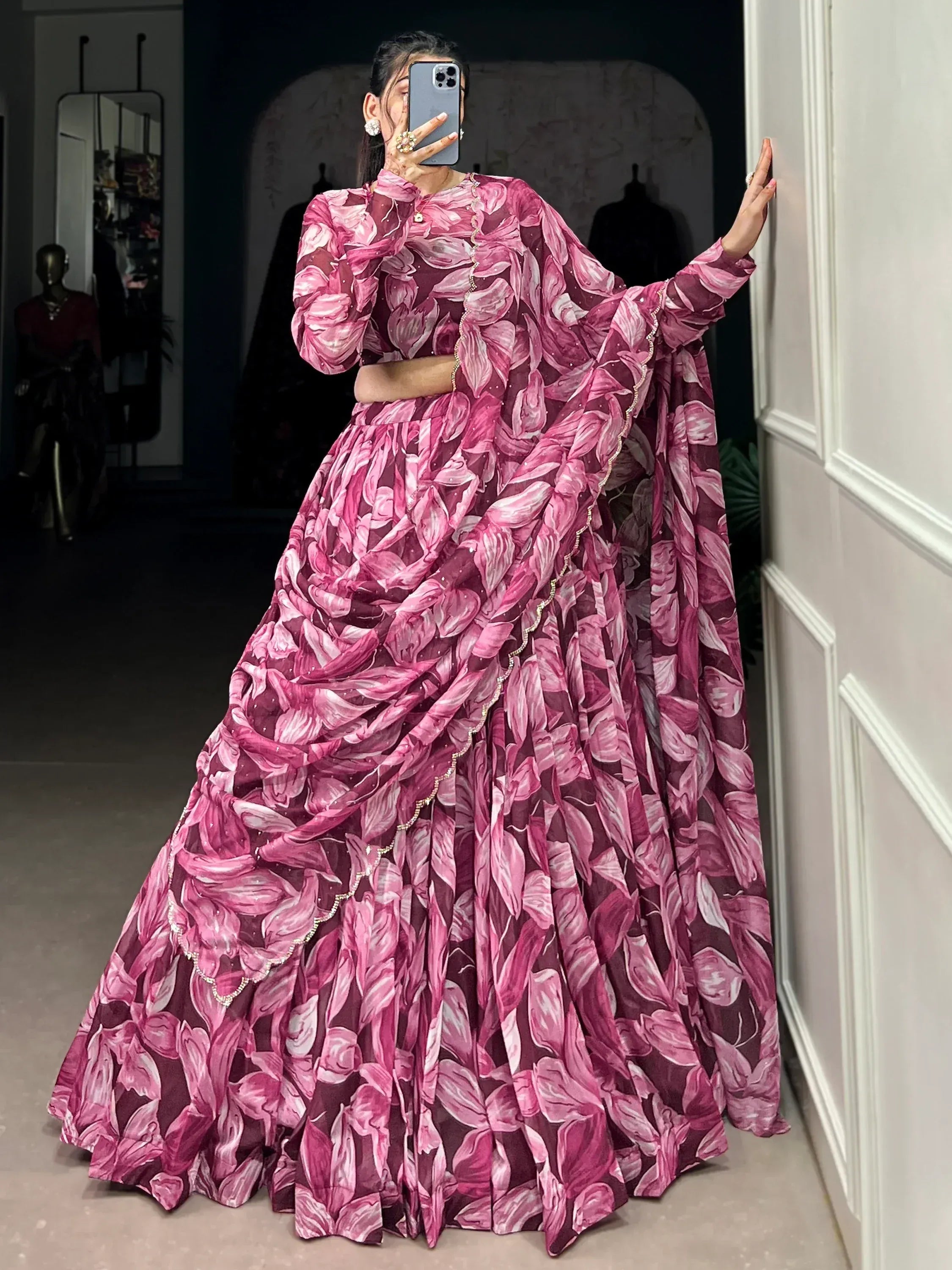 Pink floral print lehenga choli with sheer sleeves and embellished border, perfect for Indian ethnic wear.