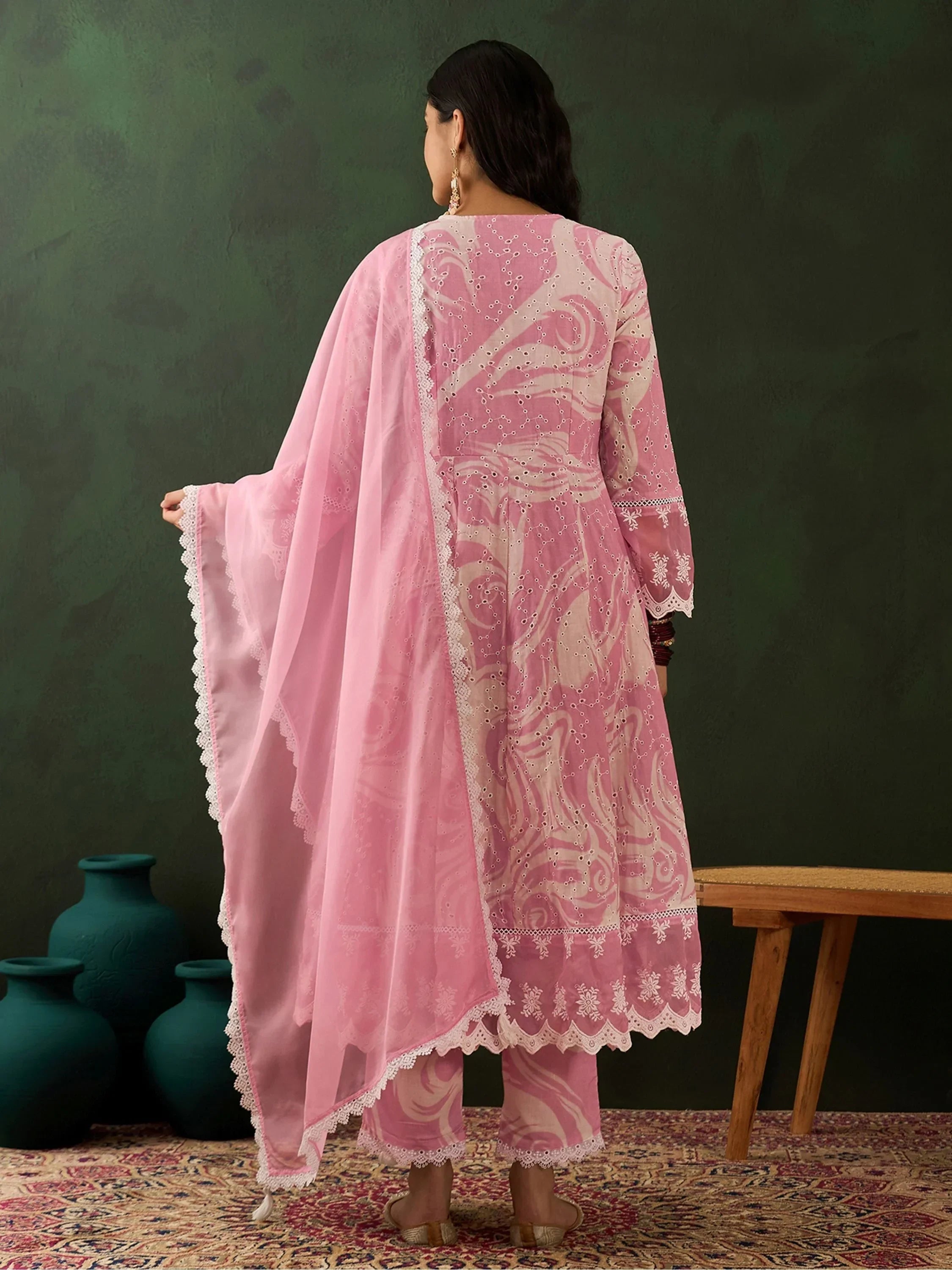 Woman in pink embroidered salwar kameez with dupatta, traditional ethnic wear