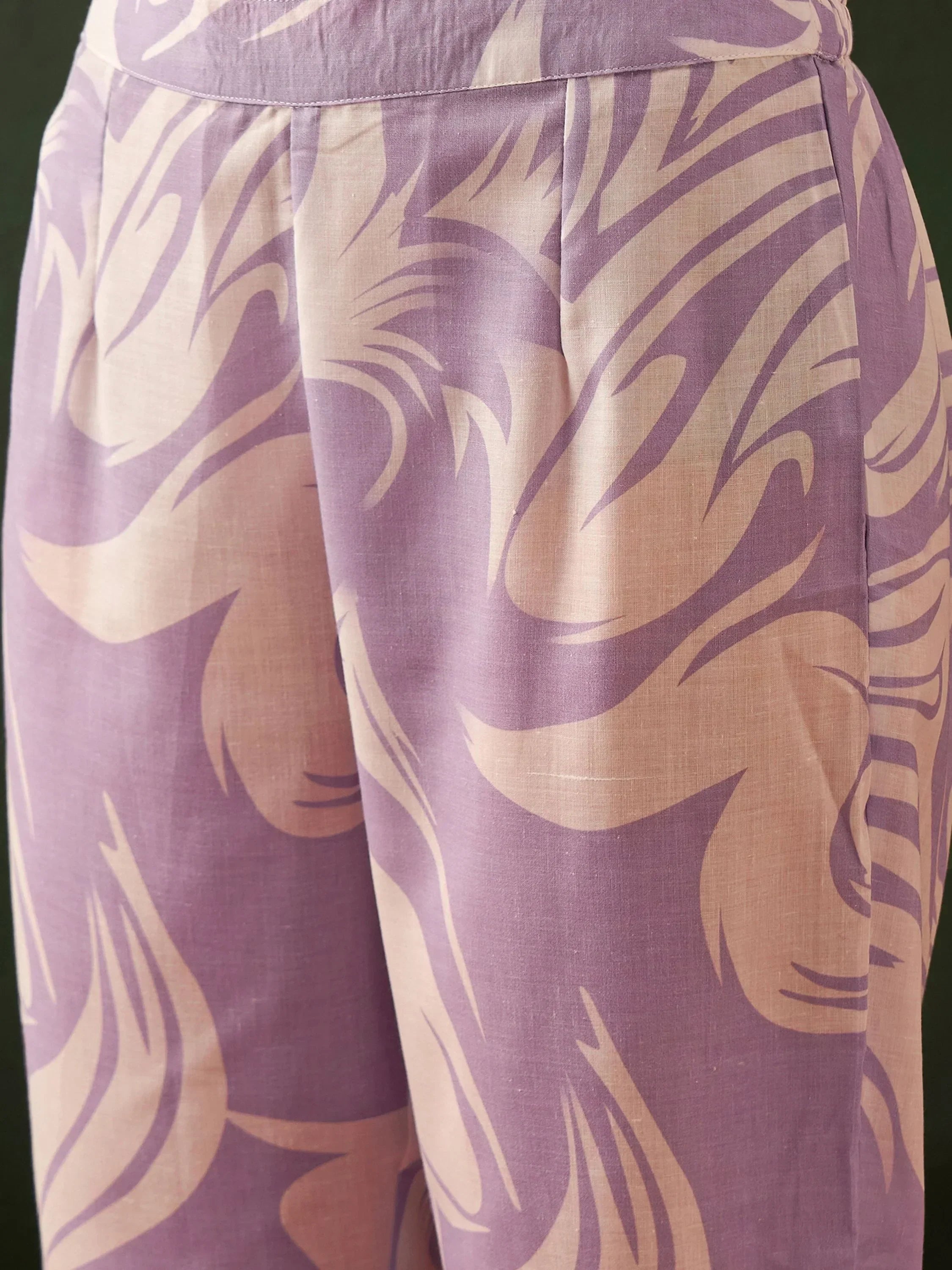 Close-up of lilac and beige ethnic print palazzo pants with abstract pattern