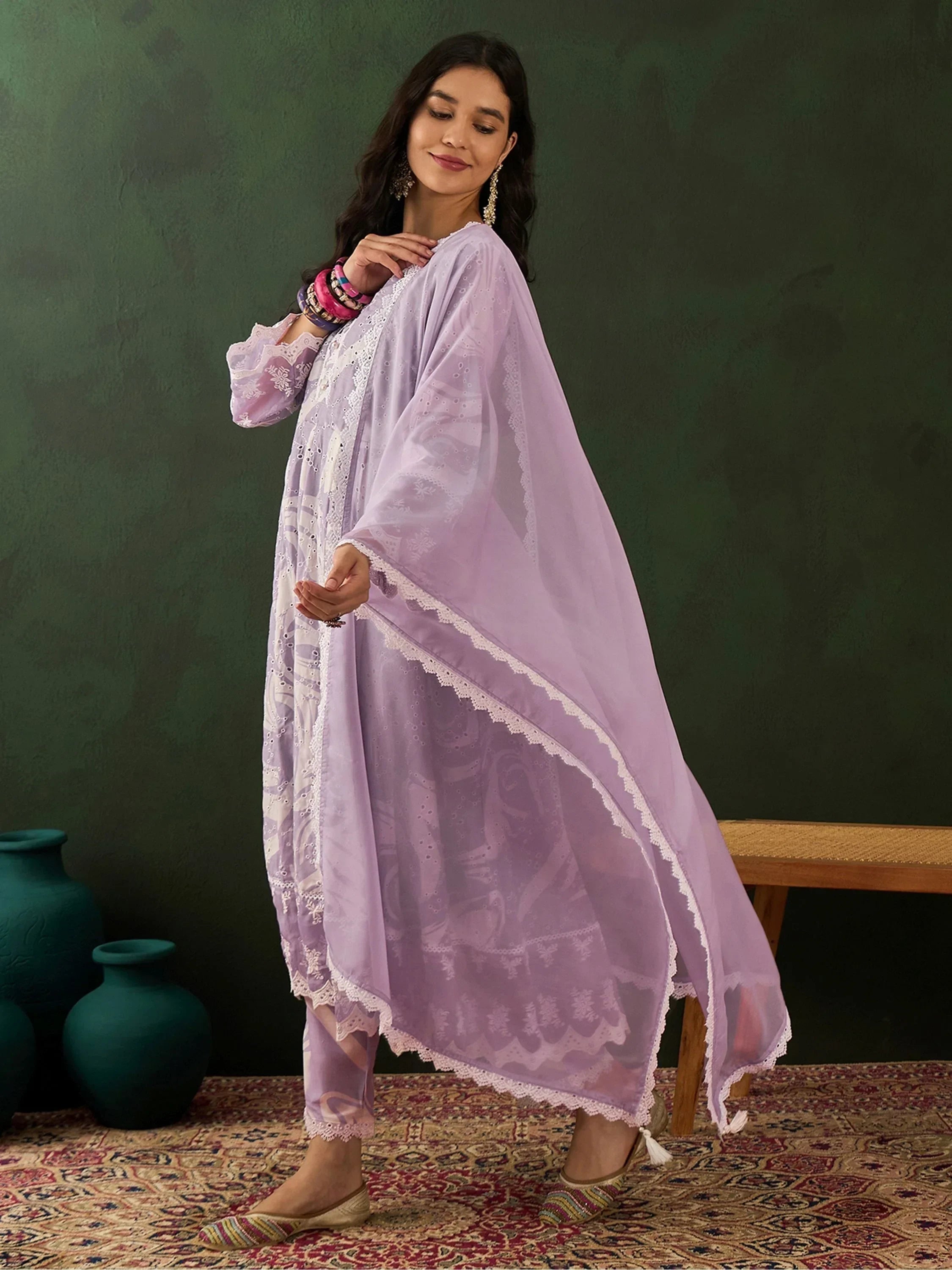 Woman in lavender embroidered salwar kameez with dupatta, traditional Indian ethnic wear