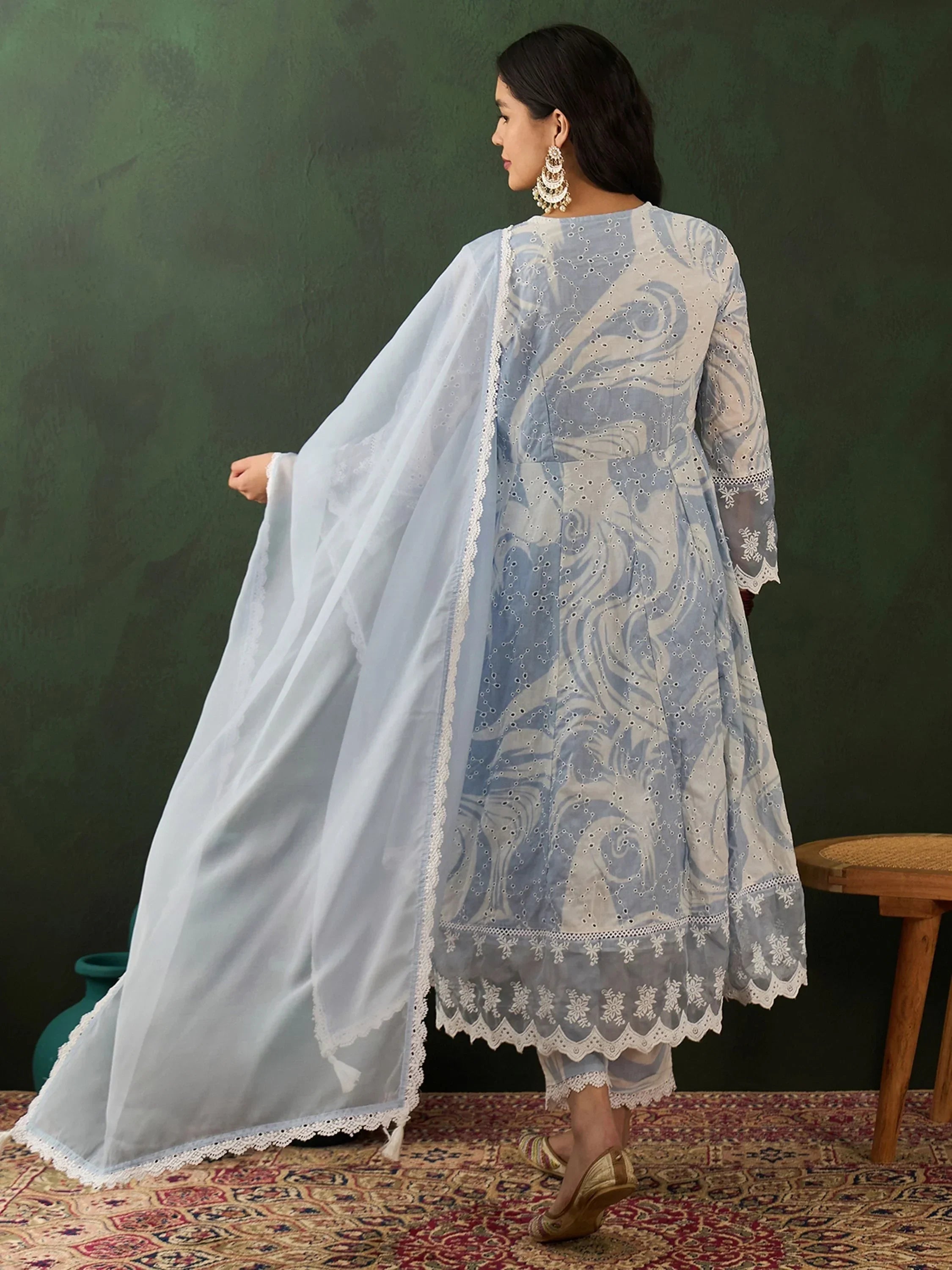 Woman in light blue embroidered salwar kameez with dupatta, traditional Indian ethnic wear