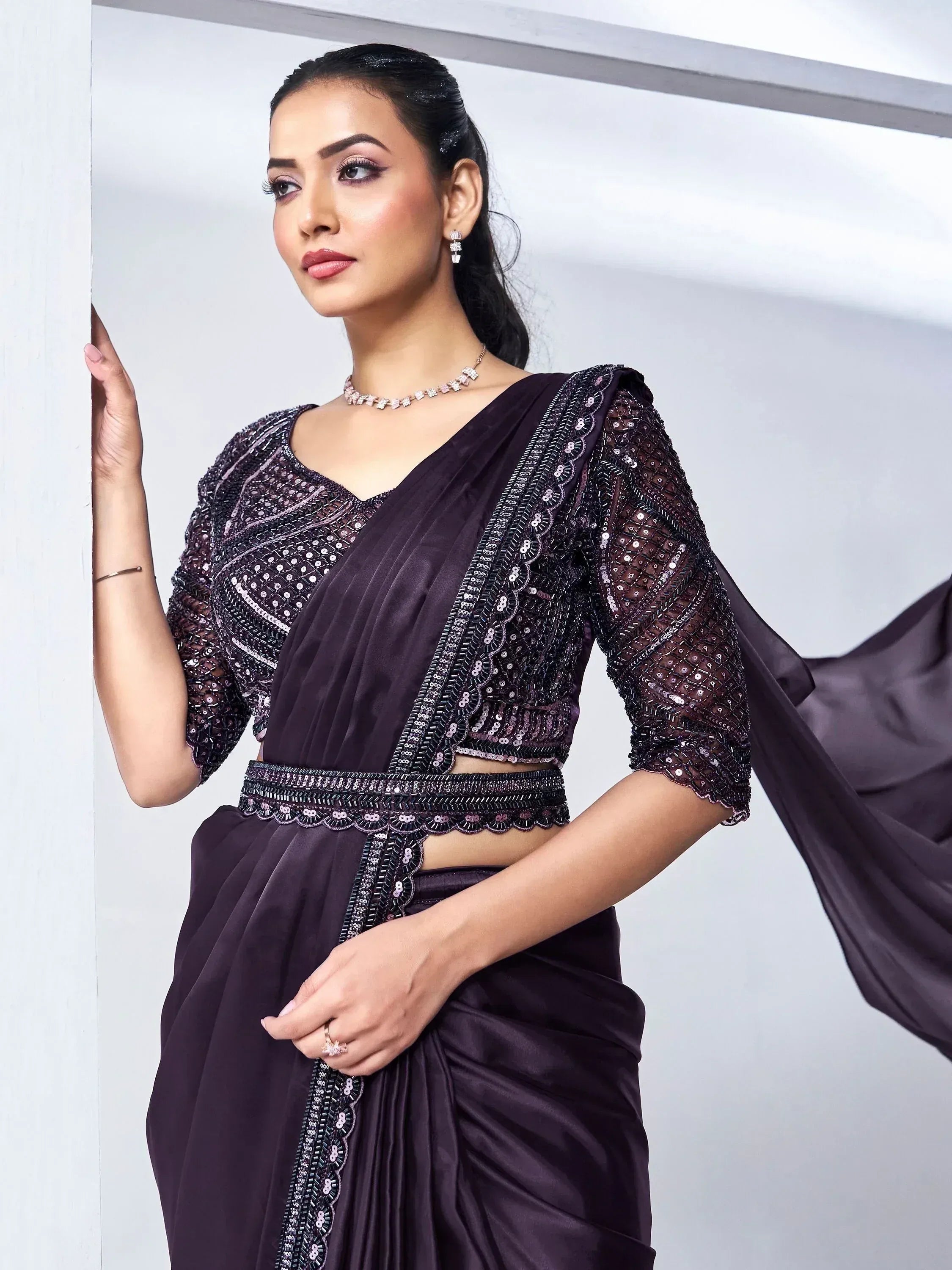 Elegant purple sequin saree with embroidered blouse, perfect for Indian ethnic wear occasions.