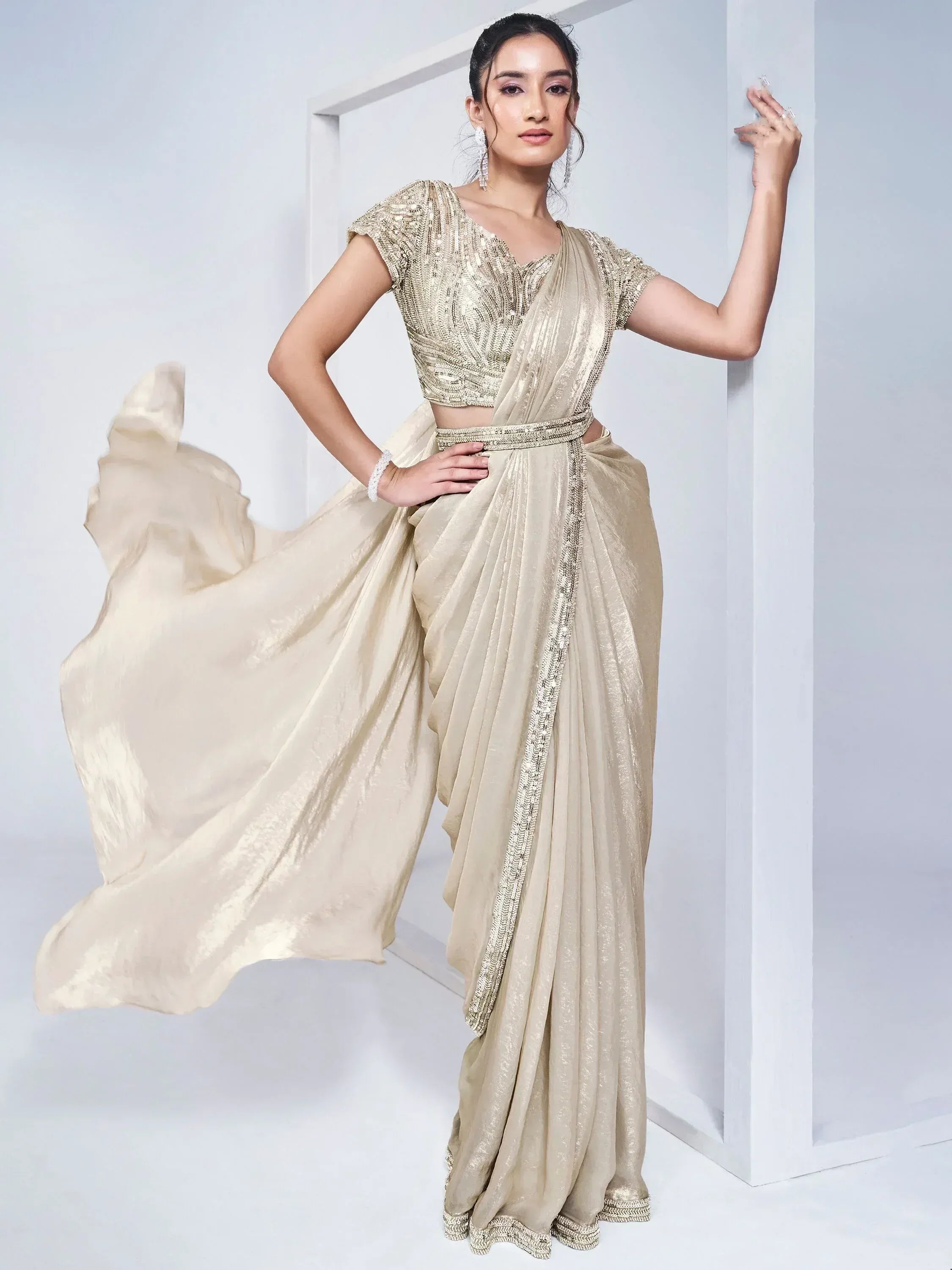 Elegant gold saree with sequined blouse, perfect for Indian ethnic occasions and weddings.