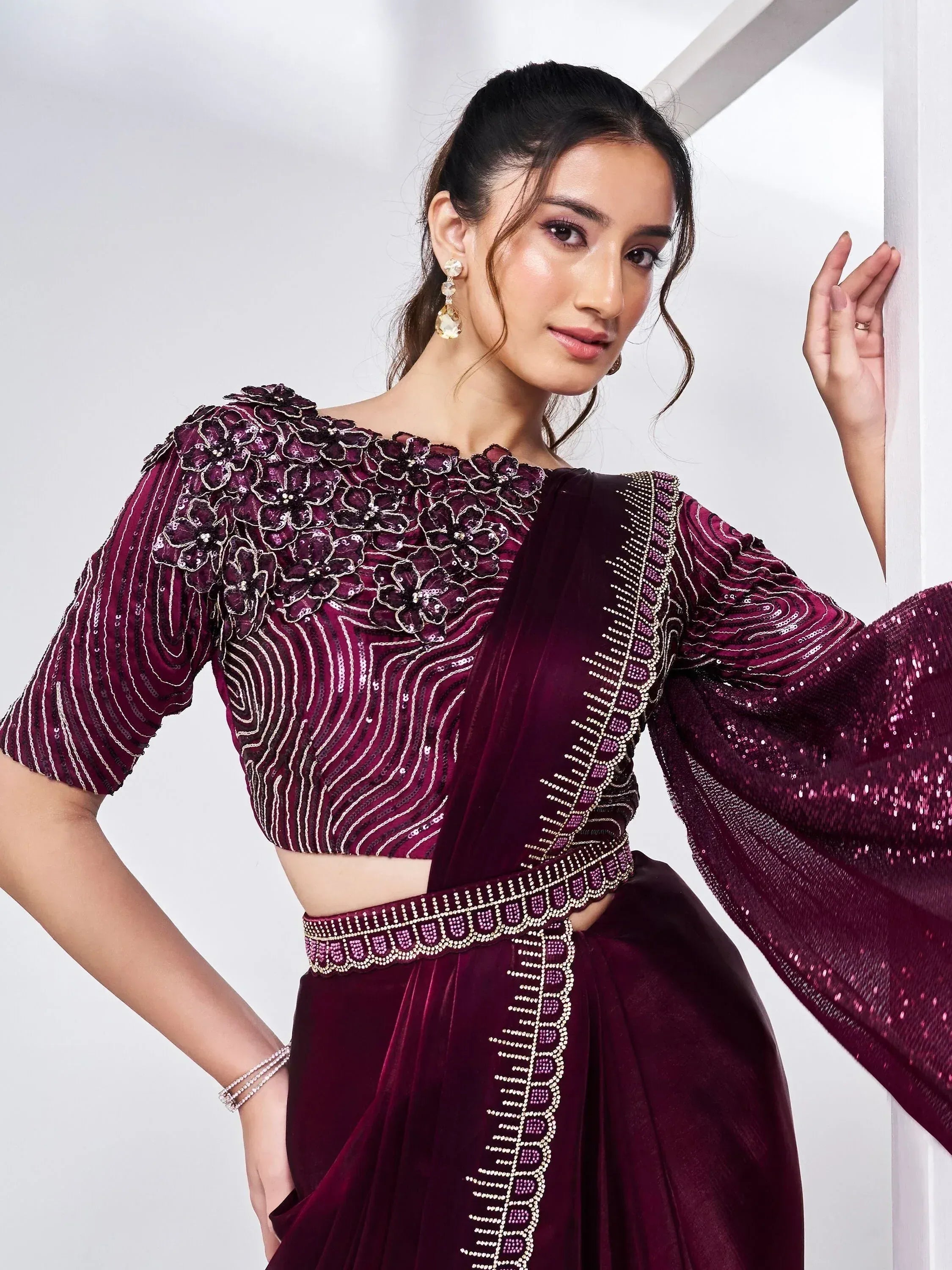 Elegant maroon lehenga choli with floral embroidery and sequin detailing, perfect for Indian ethnic wear.