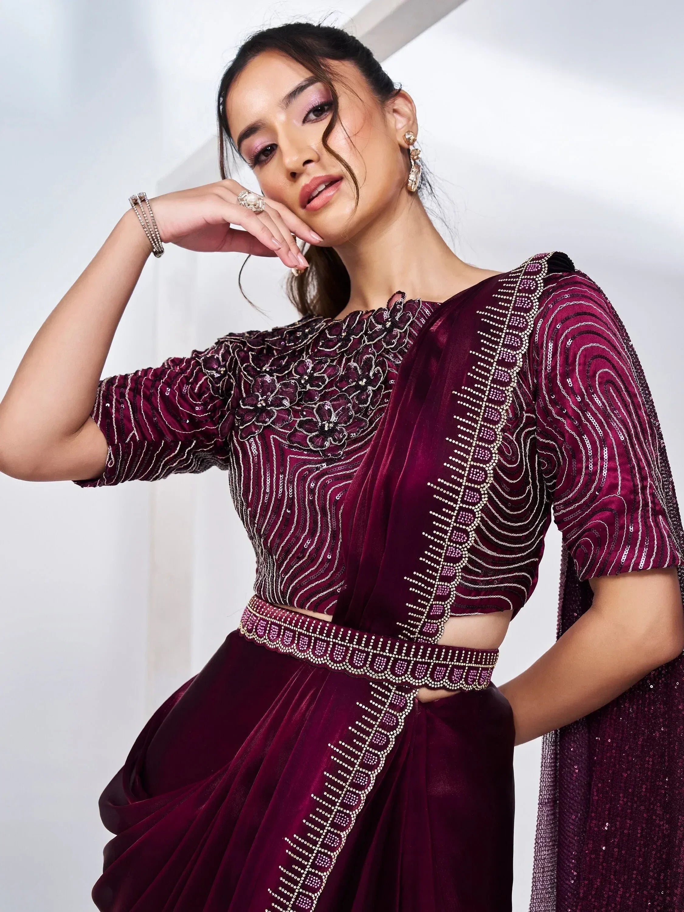 Elegant maroon velvet lehenga choli with intricate sequin and beadwork, perfect for Indian ethnic occasions.
