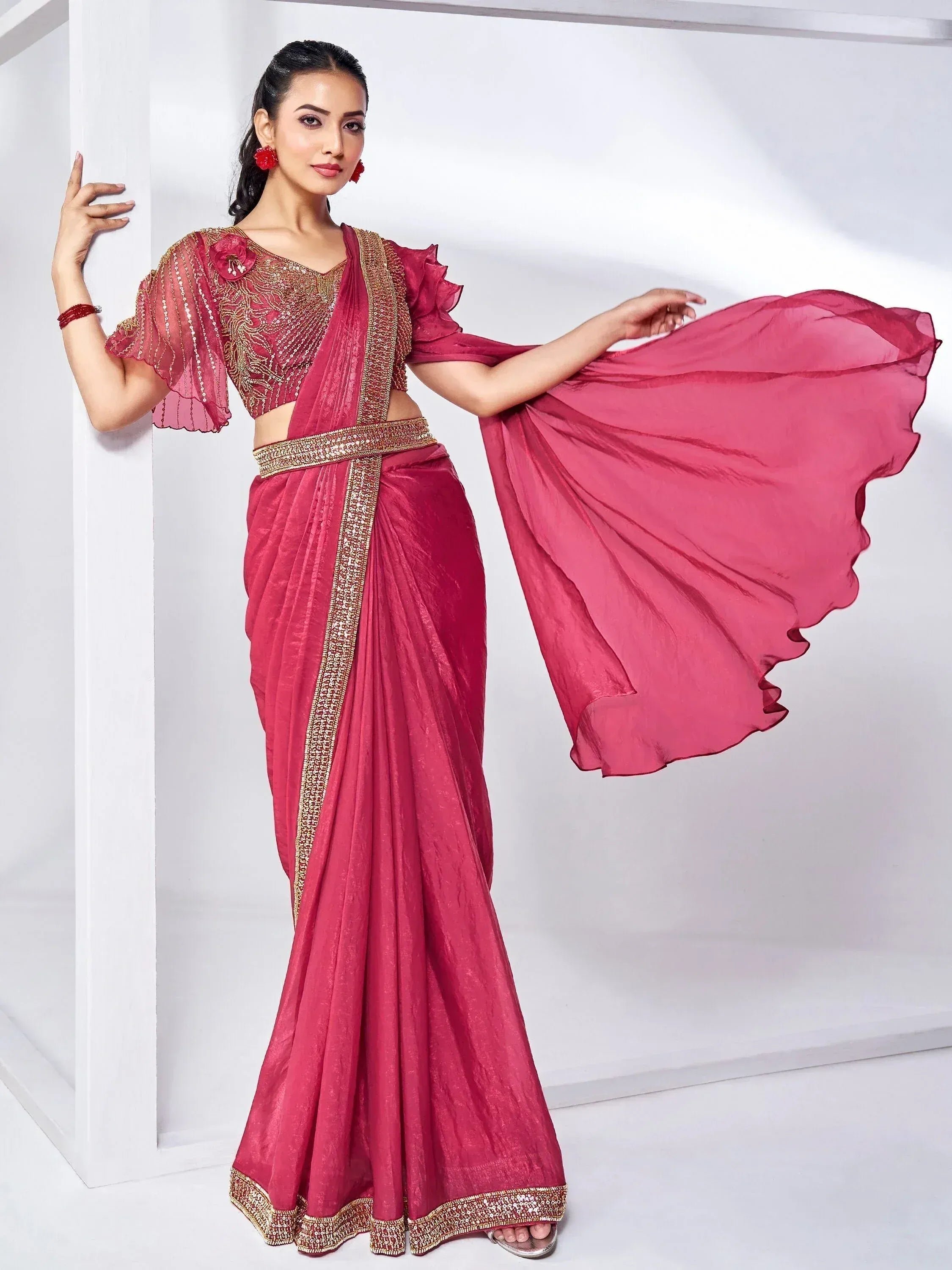 Pink designer saree with gold embroidery and ruffled blouse, ethnic Indian wear