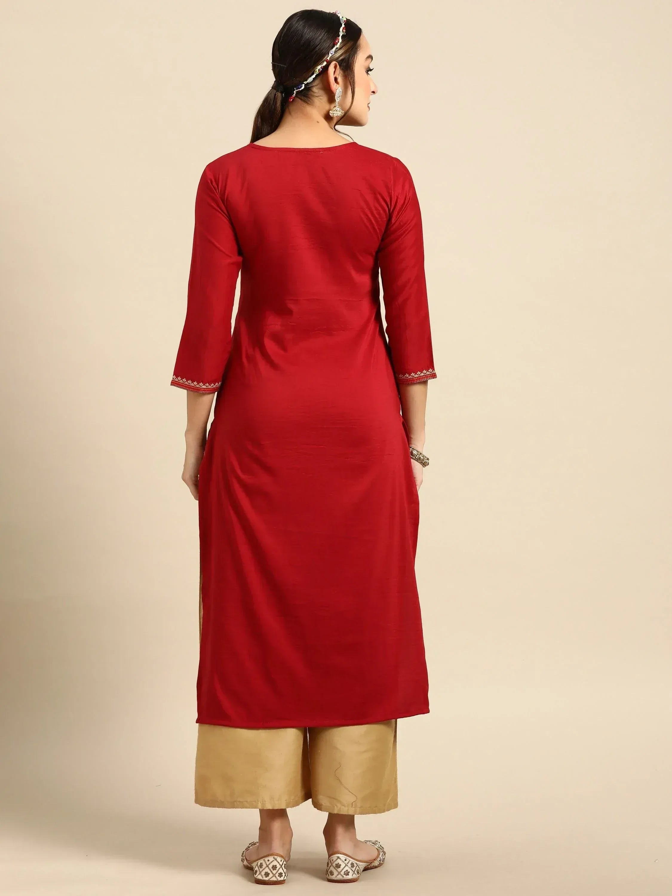 Red ethnic kurti with embroidered sleeves paired with beige palazzo pants, perfect for Indian wear