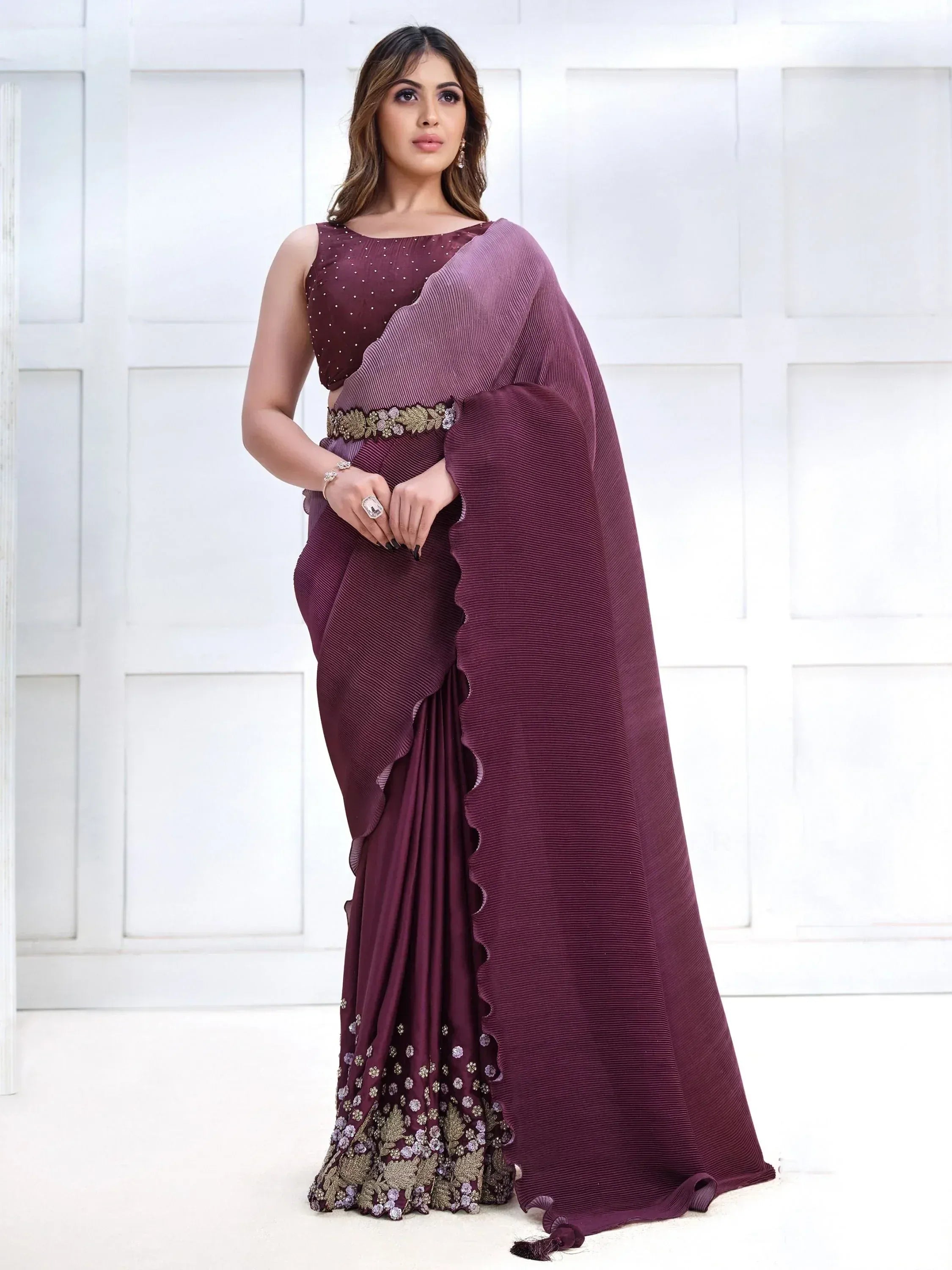 Elegant maroon pleated saree with floral embroidery and embellished belt, perfect for Indian ethnic occasions.