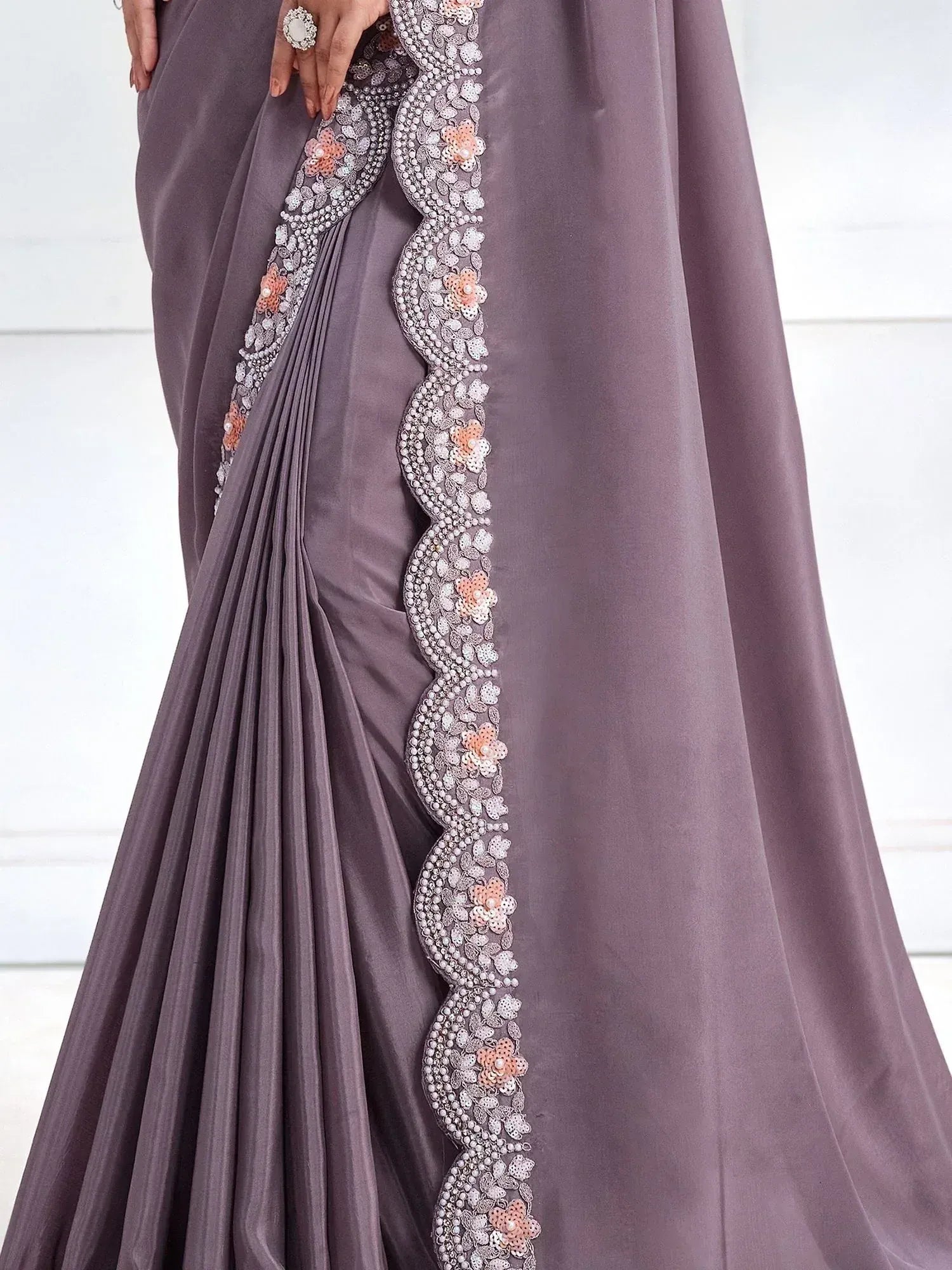 Elegant mauve saree with floral sequin and bead border, perfect for Indian ethnic occasions.