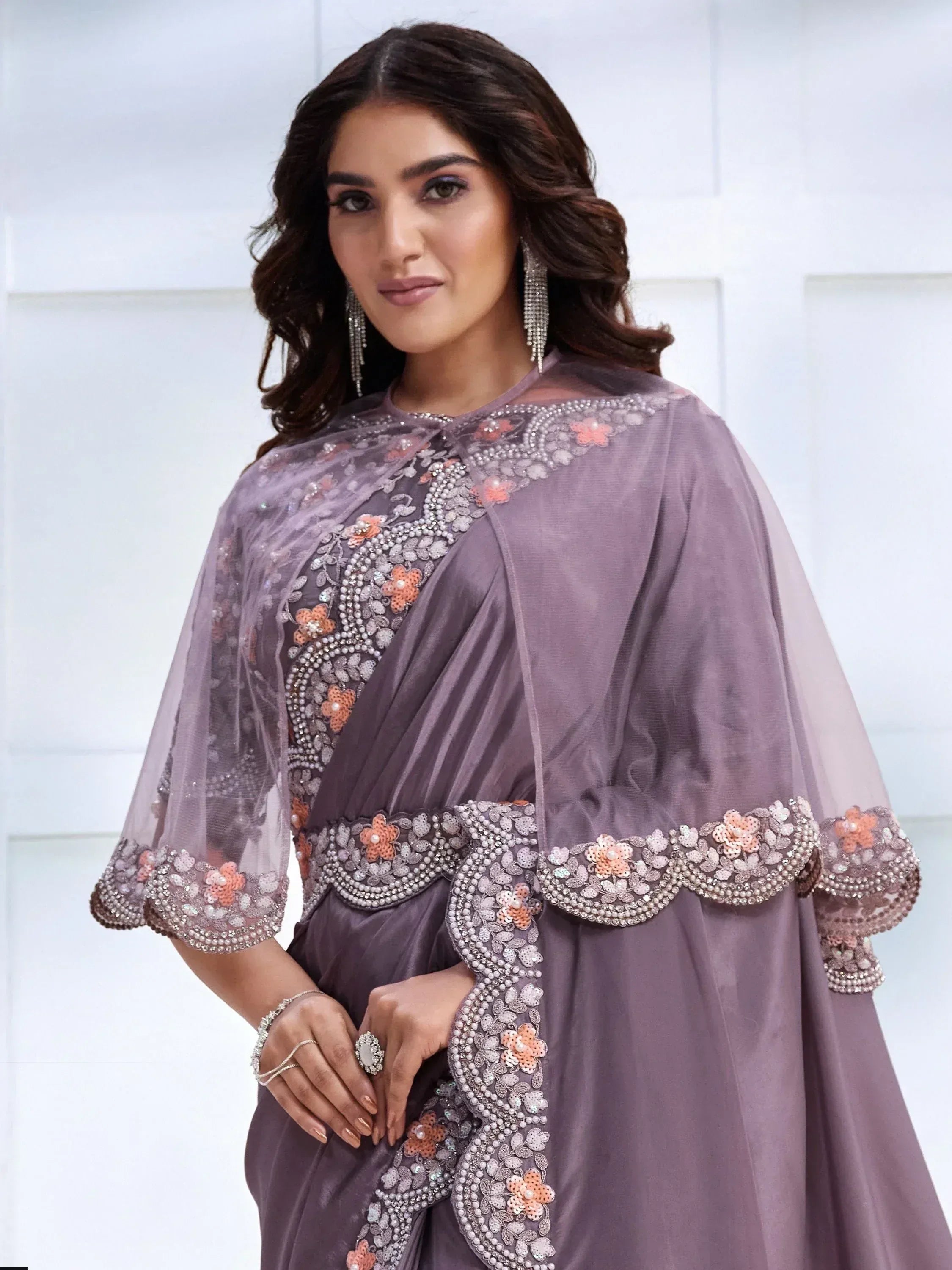 Elegant purple ethnic gown with floral beadwork and sheer cape, perfect for Indian occasions.