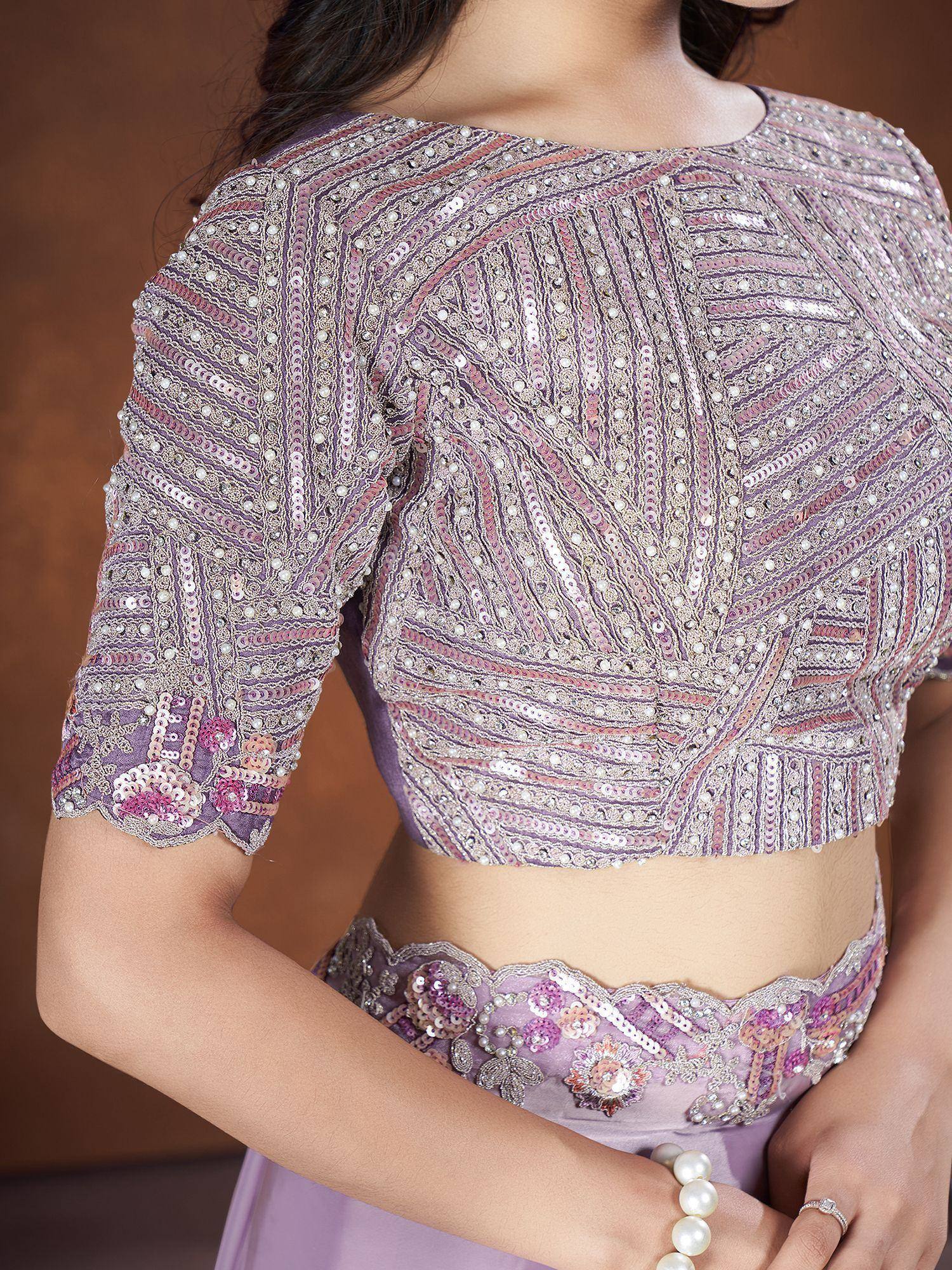 Lavender designer lehenga choli with intricate sequin and pearl embroidery, perfect for Indian ethnic wear.